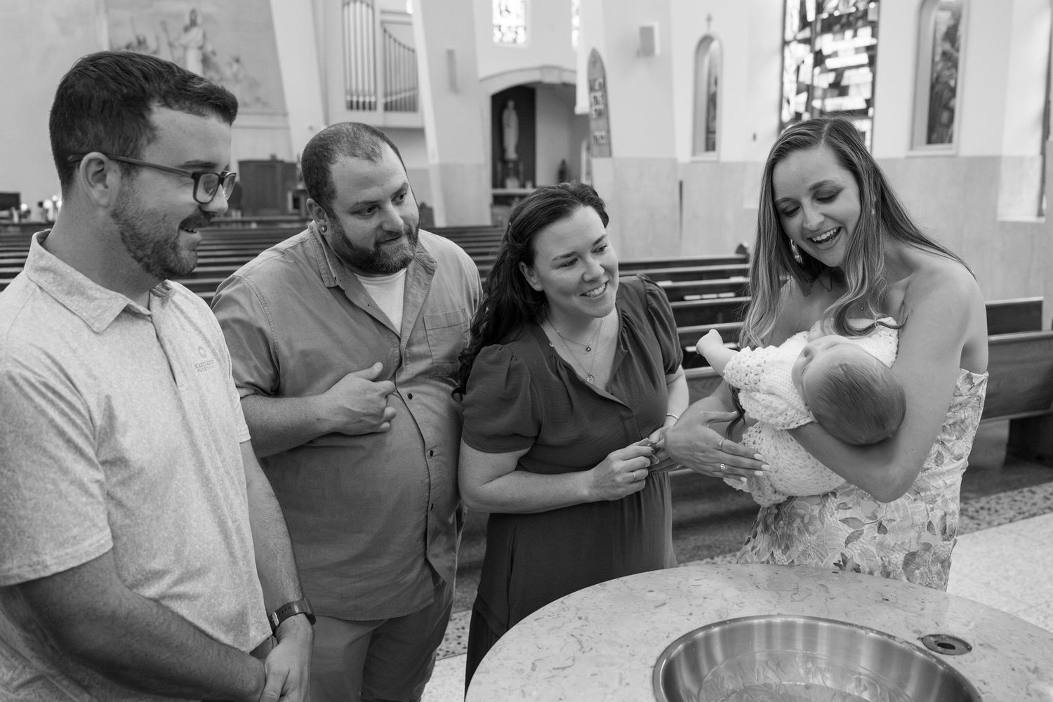 A series of black and white photos showing joyful candid moments and interactions between people in a casual setting.