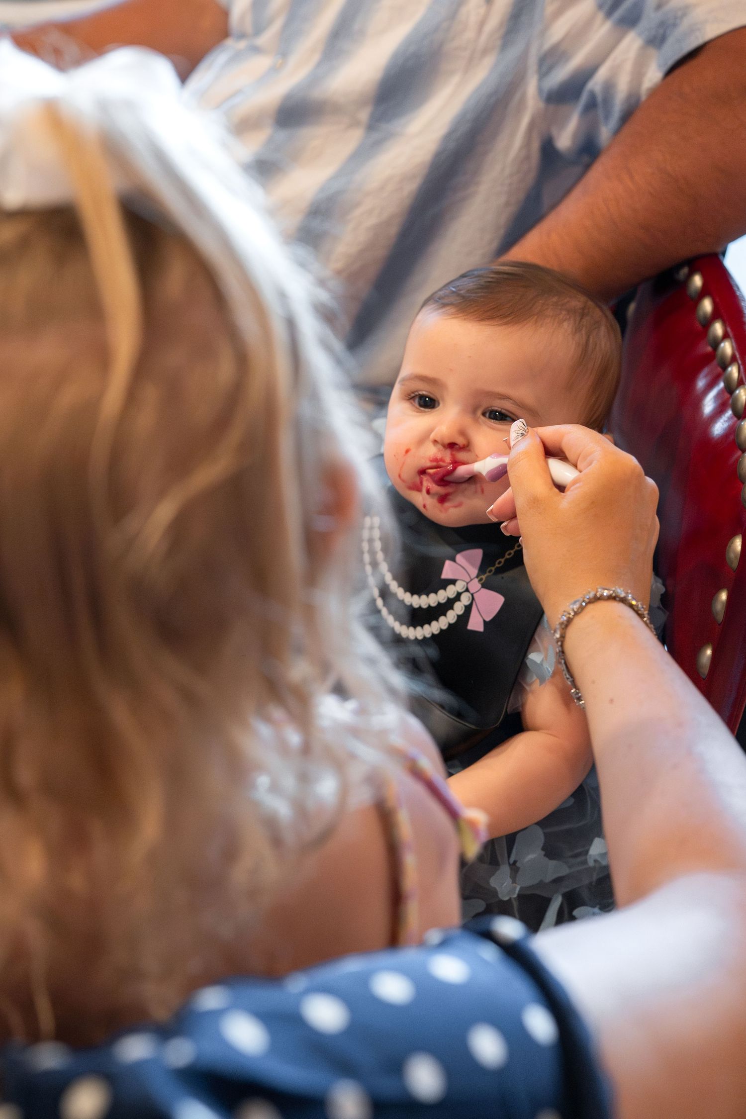 Close-up detail of someone applying makeup during a formal event preparation.