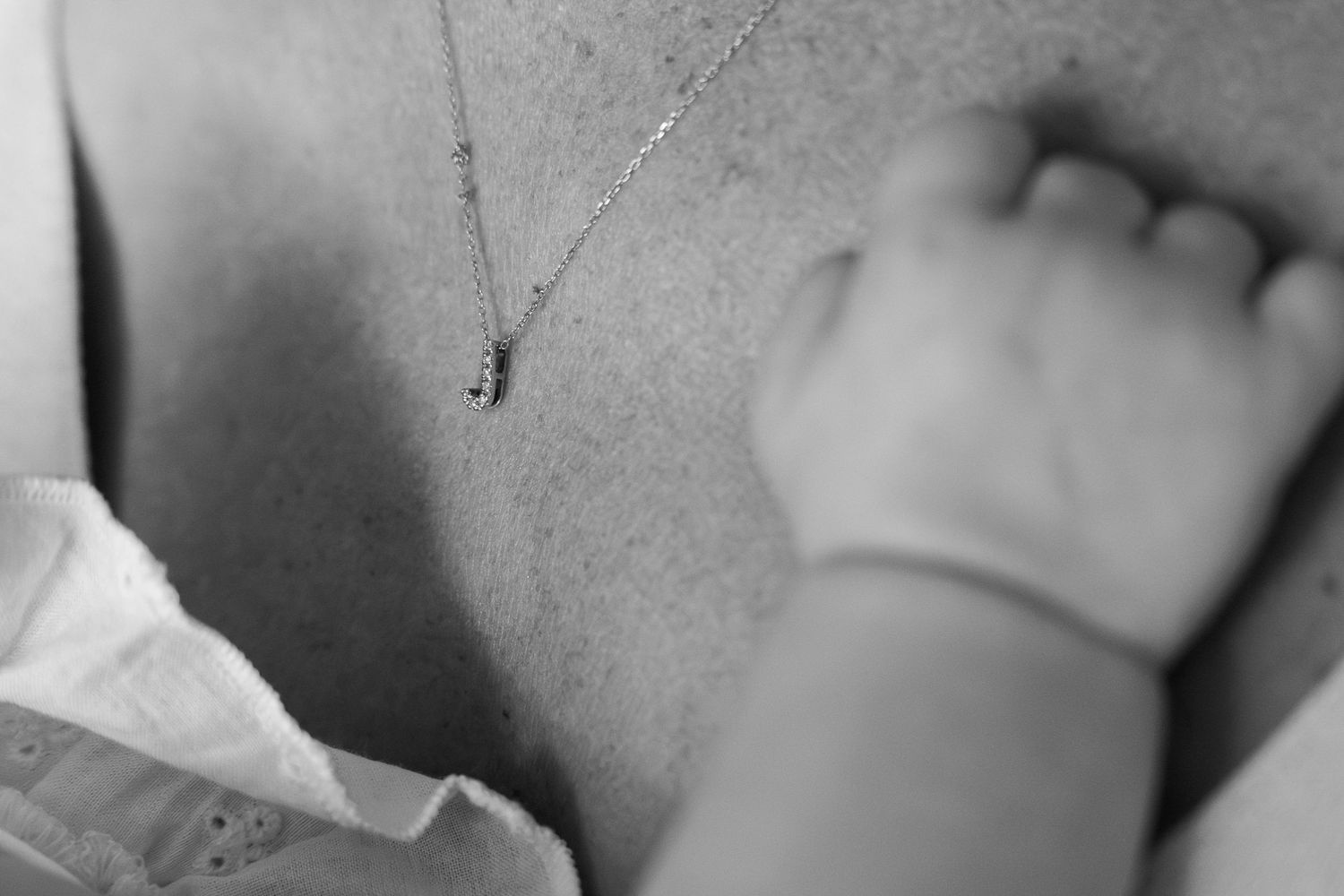 Artistic black and white macro shots focusing on intimate family details.
