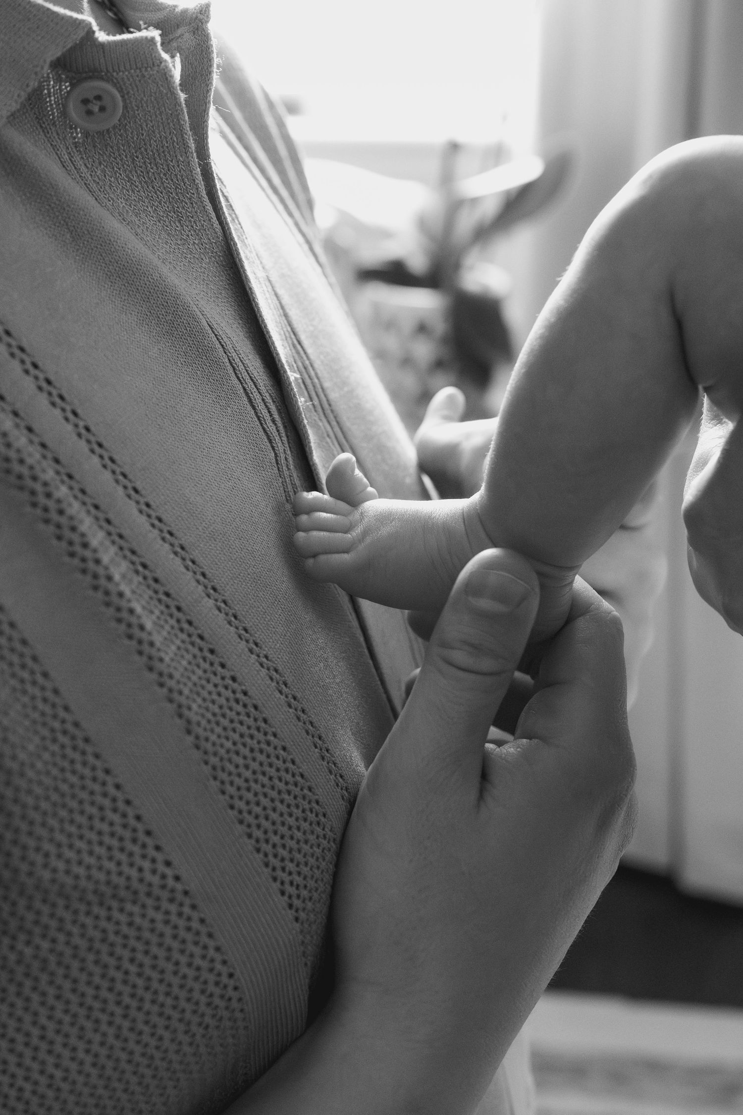 Close-up black and white shots capture intimate family bonding moments.