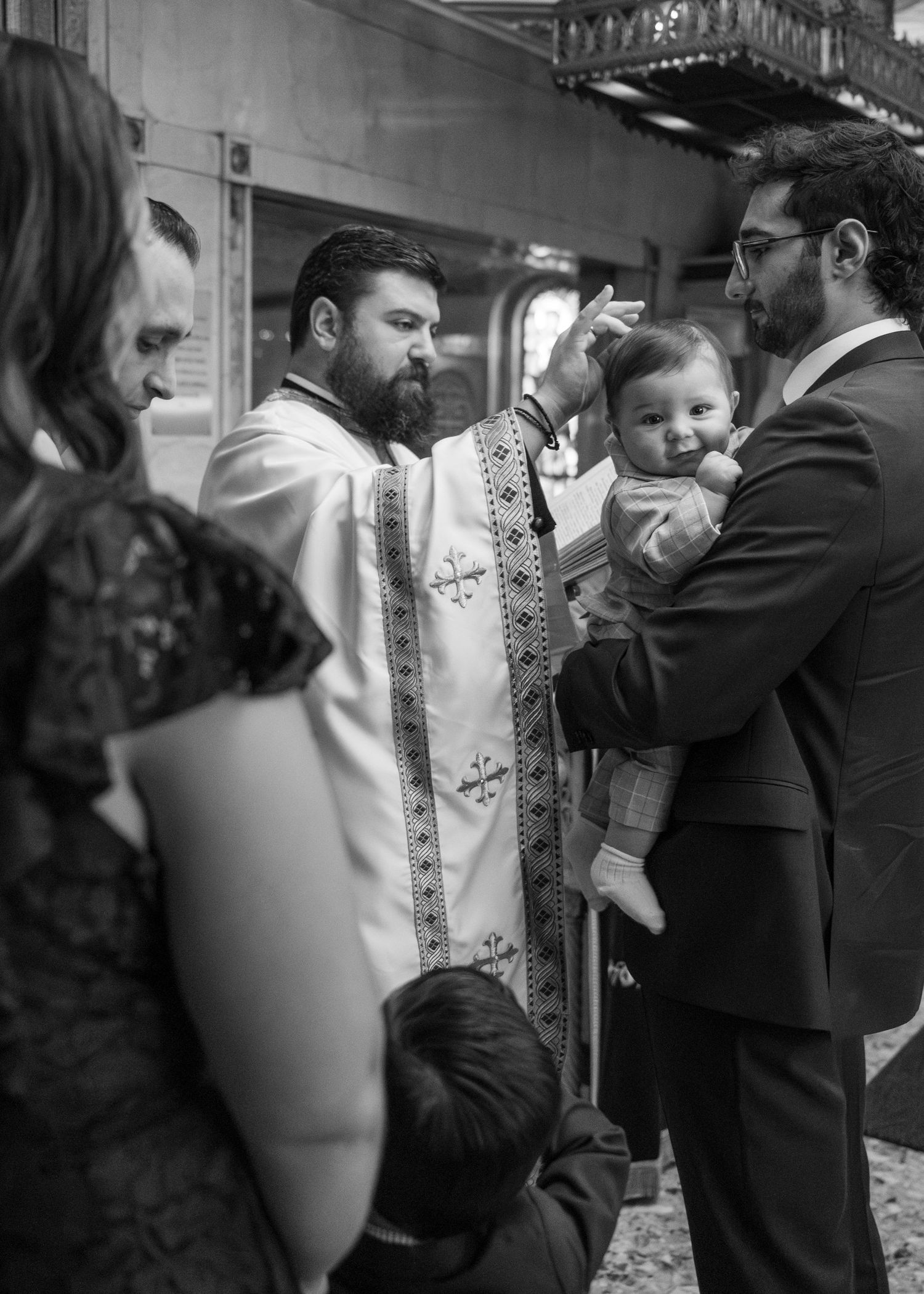 A sequence of images showing a baptism ceremony with traditional white christening gown and religious elements.