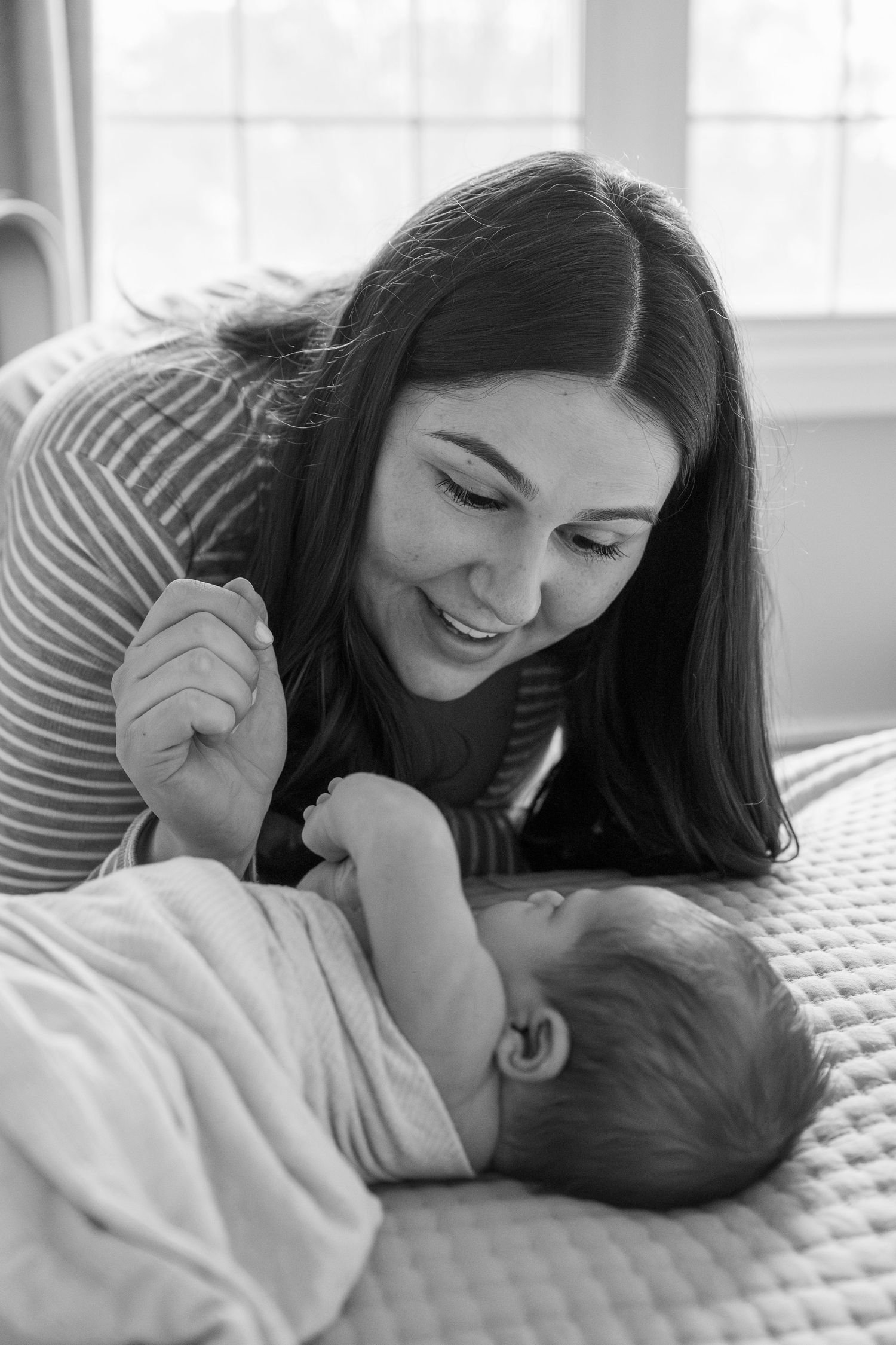A series of intimate black and white photos showing tender moments of care and connection.