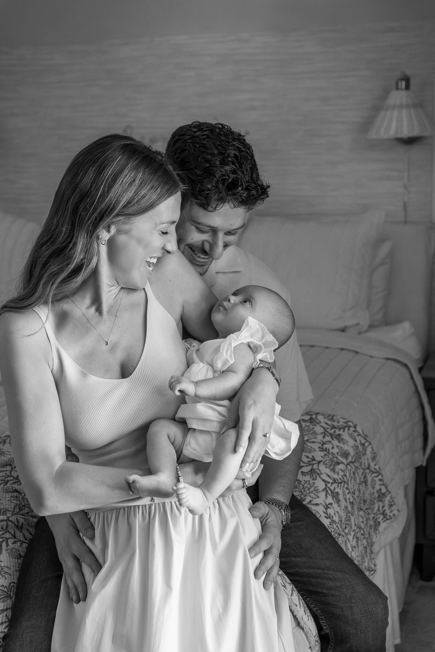 Gentle black and white series capturing tender family moments with newborn.
