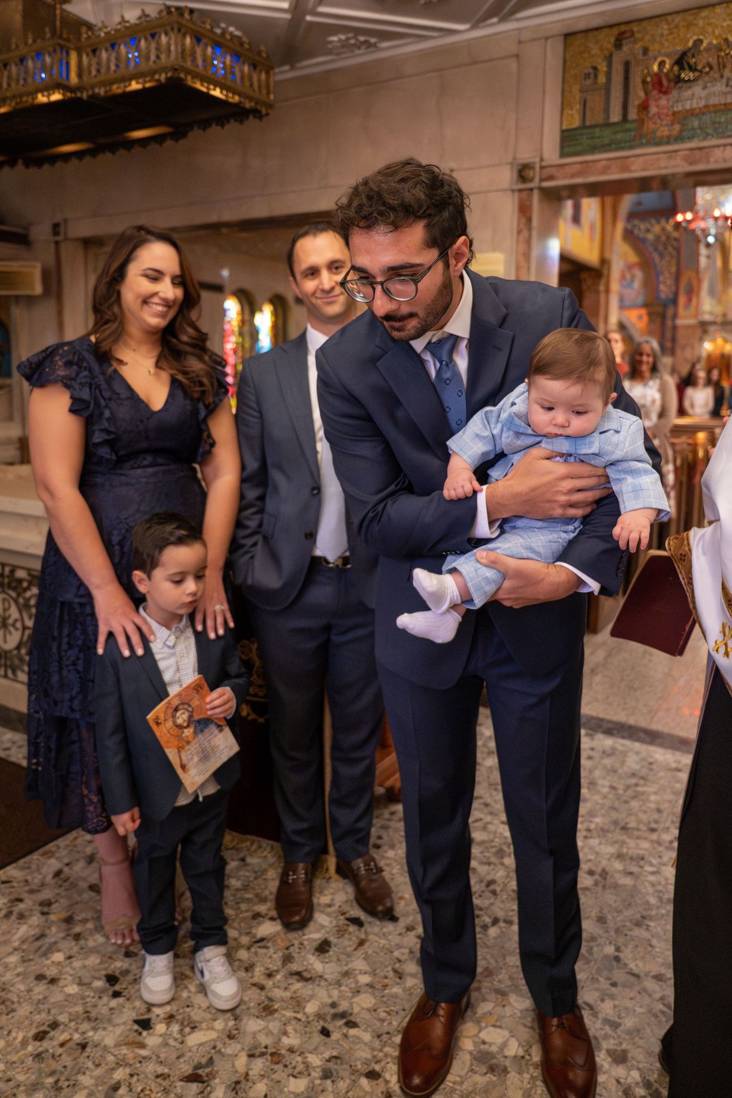 A series of candid moments showing playful interactions between adults and a young child at a formal event.