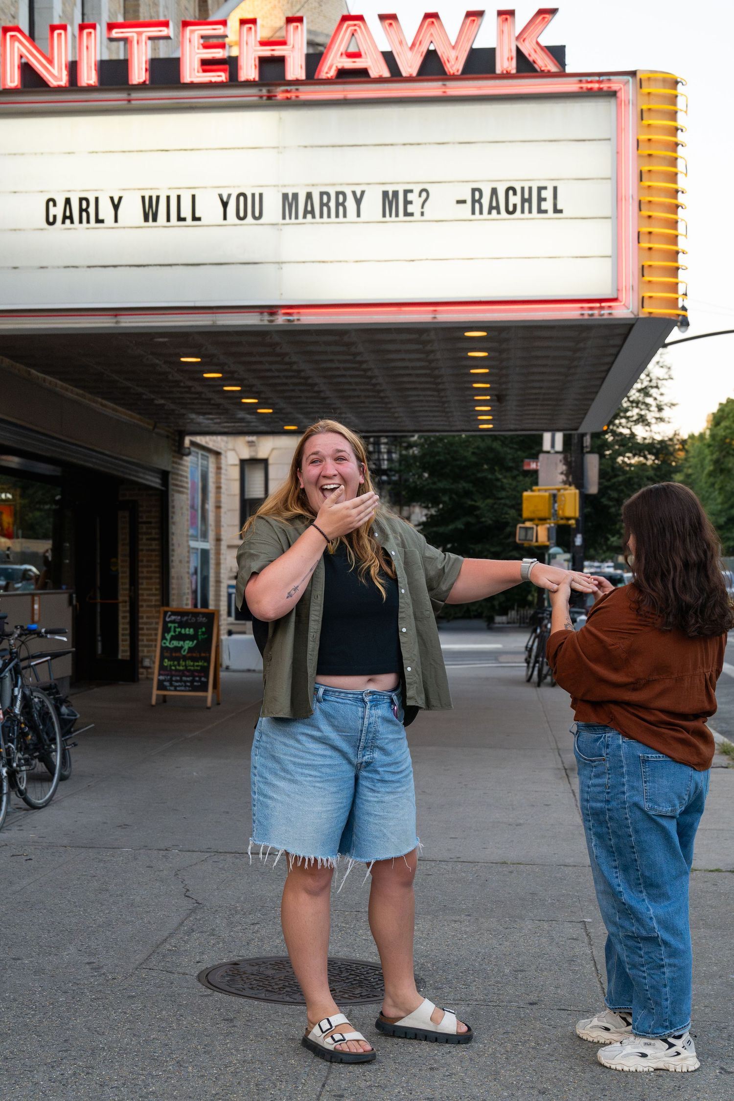 A series of photos showing a marriage proposal scene outside a movie theater with a marquee sign.
