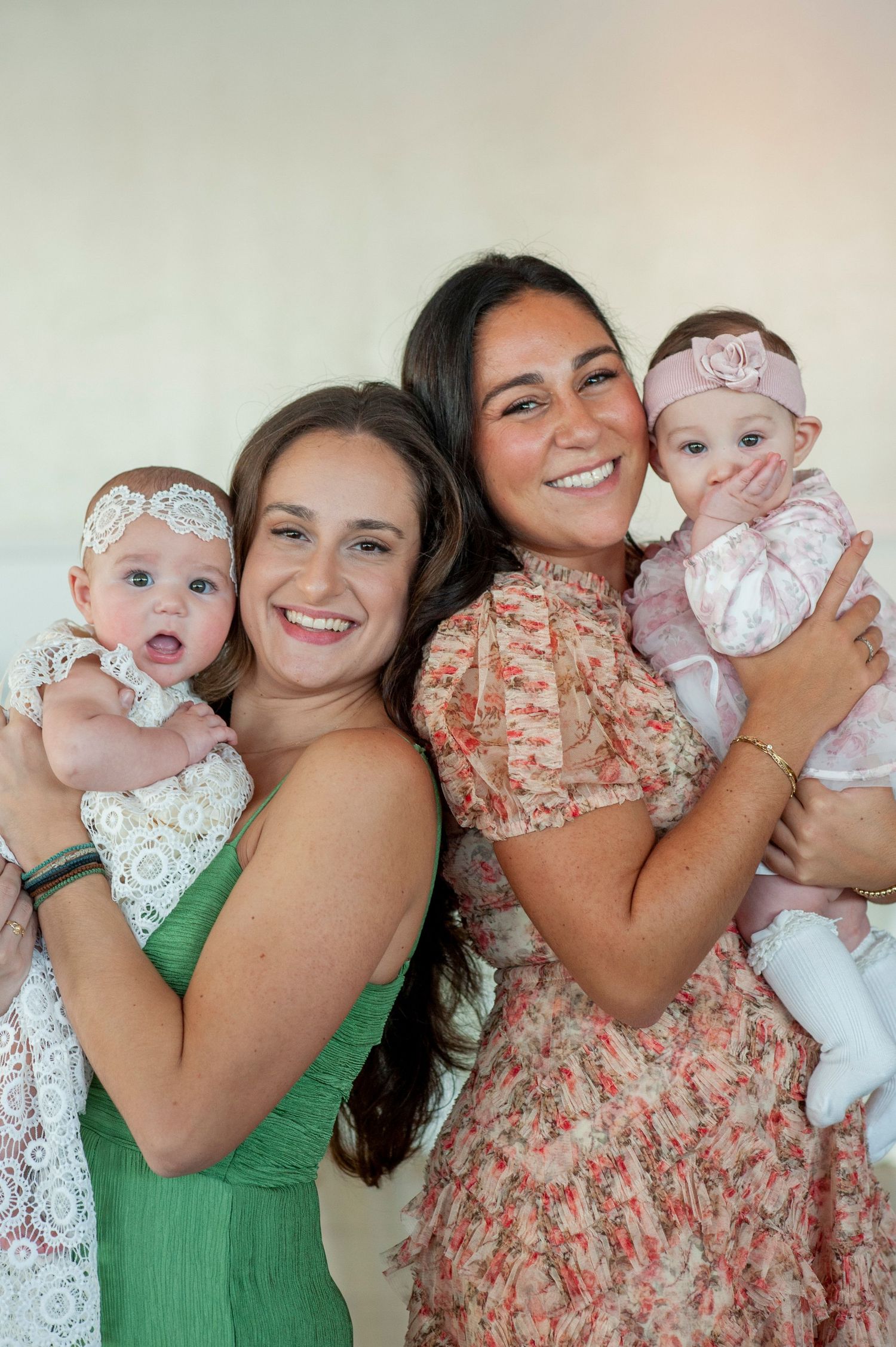 A series of candid photos show joyful moments with a baby in white lace dress.