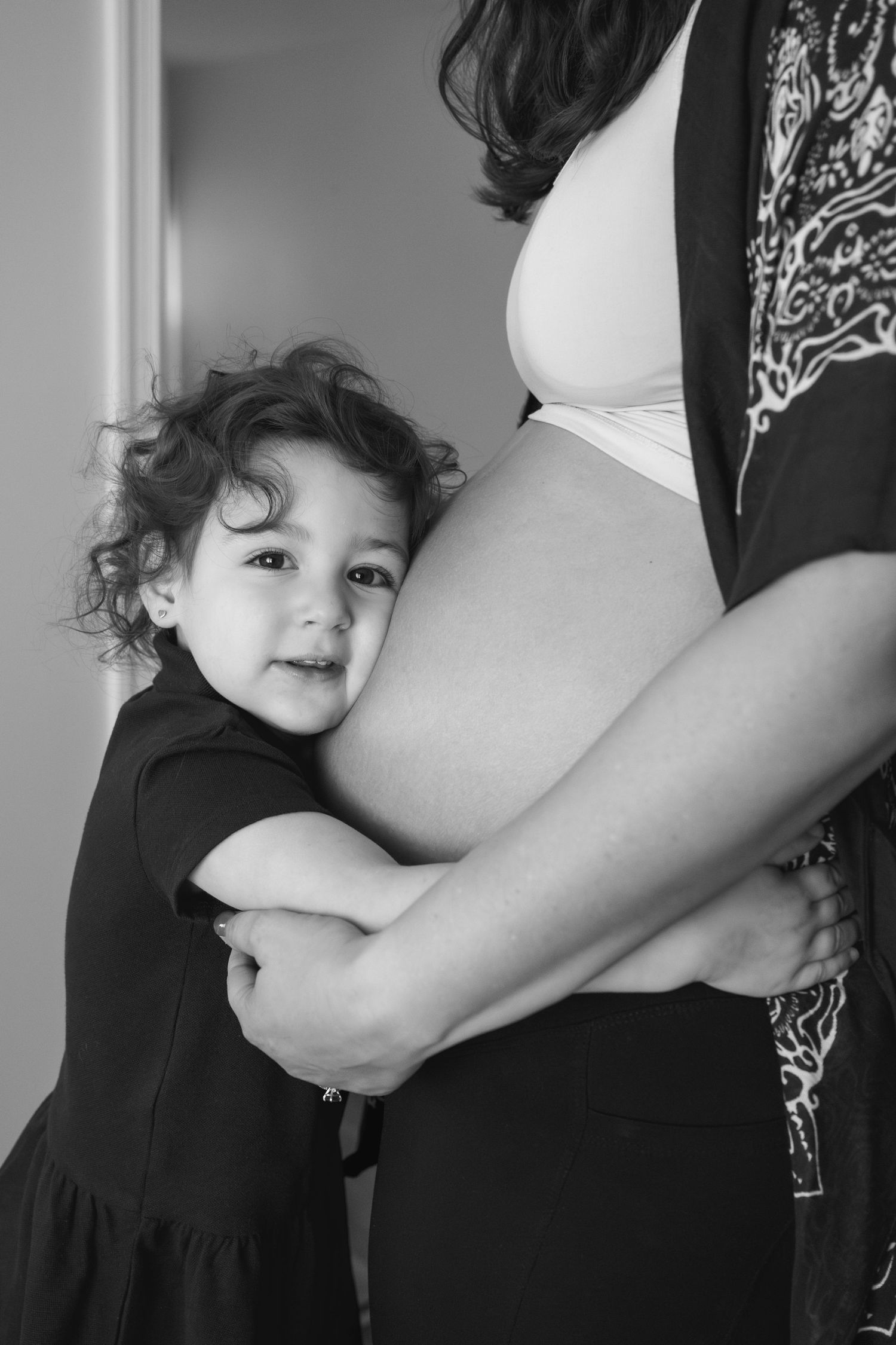 A series of black and white photos showing a breastfeeding mother nursing her baby in different positions.