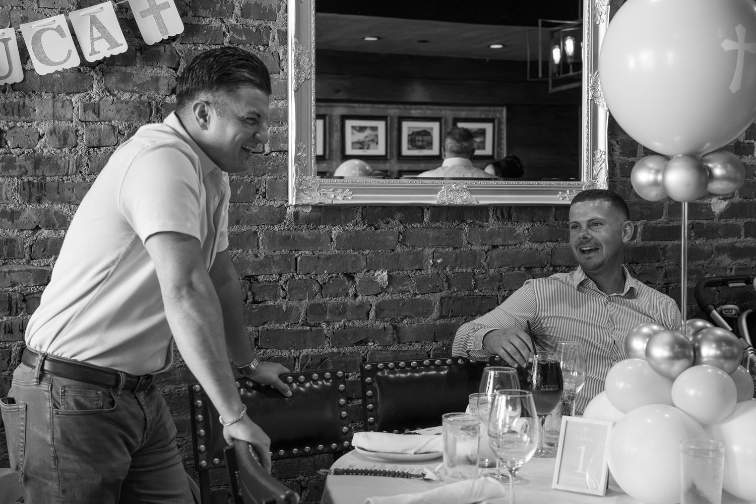A collage of black and white photos showing people dining and socializing at a restaurant with exposed brick walls.