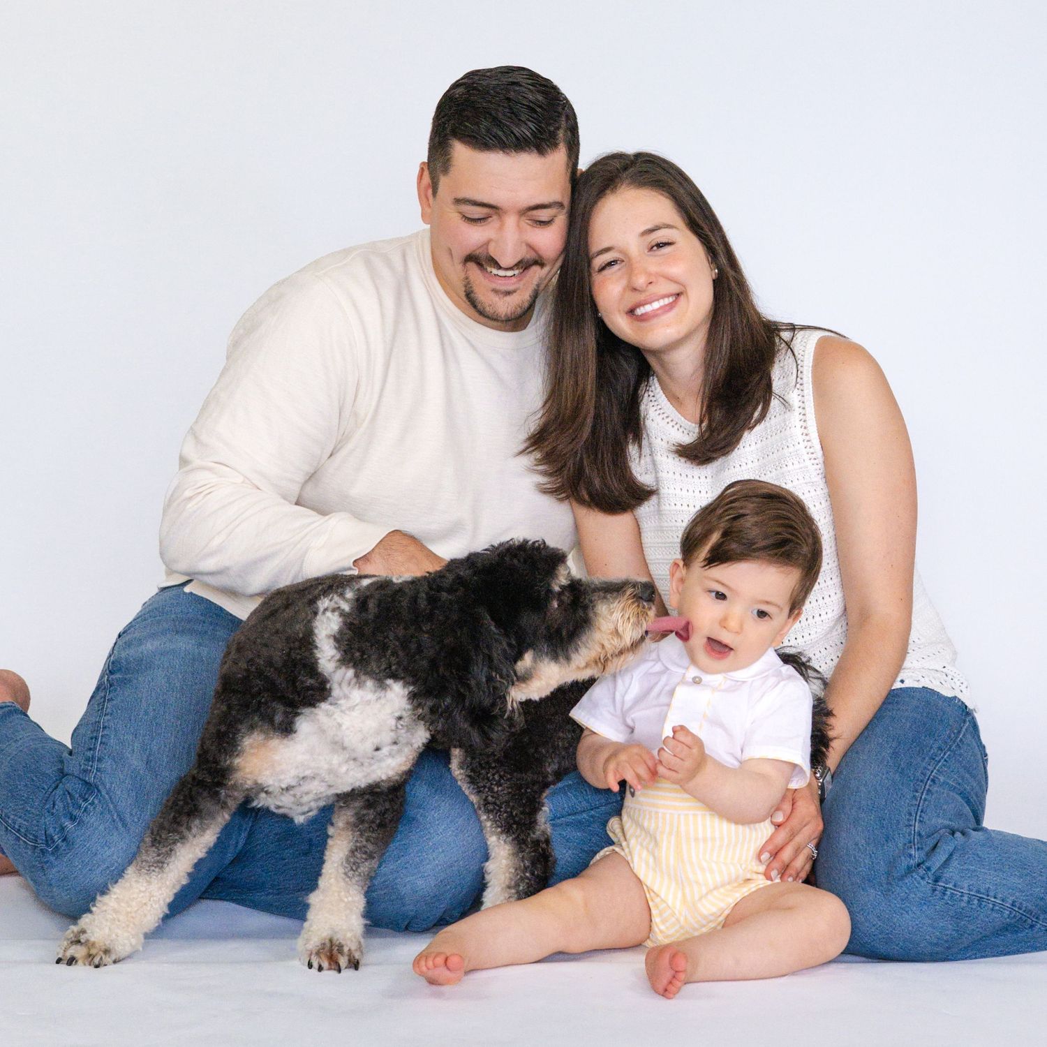 Family photos with a black and white dog on white background showing loving moments together.