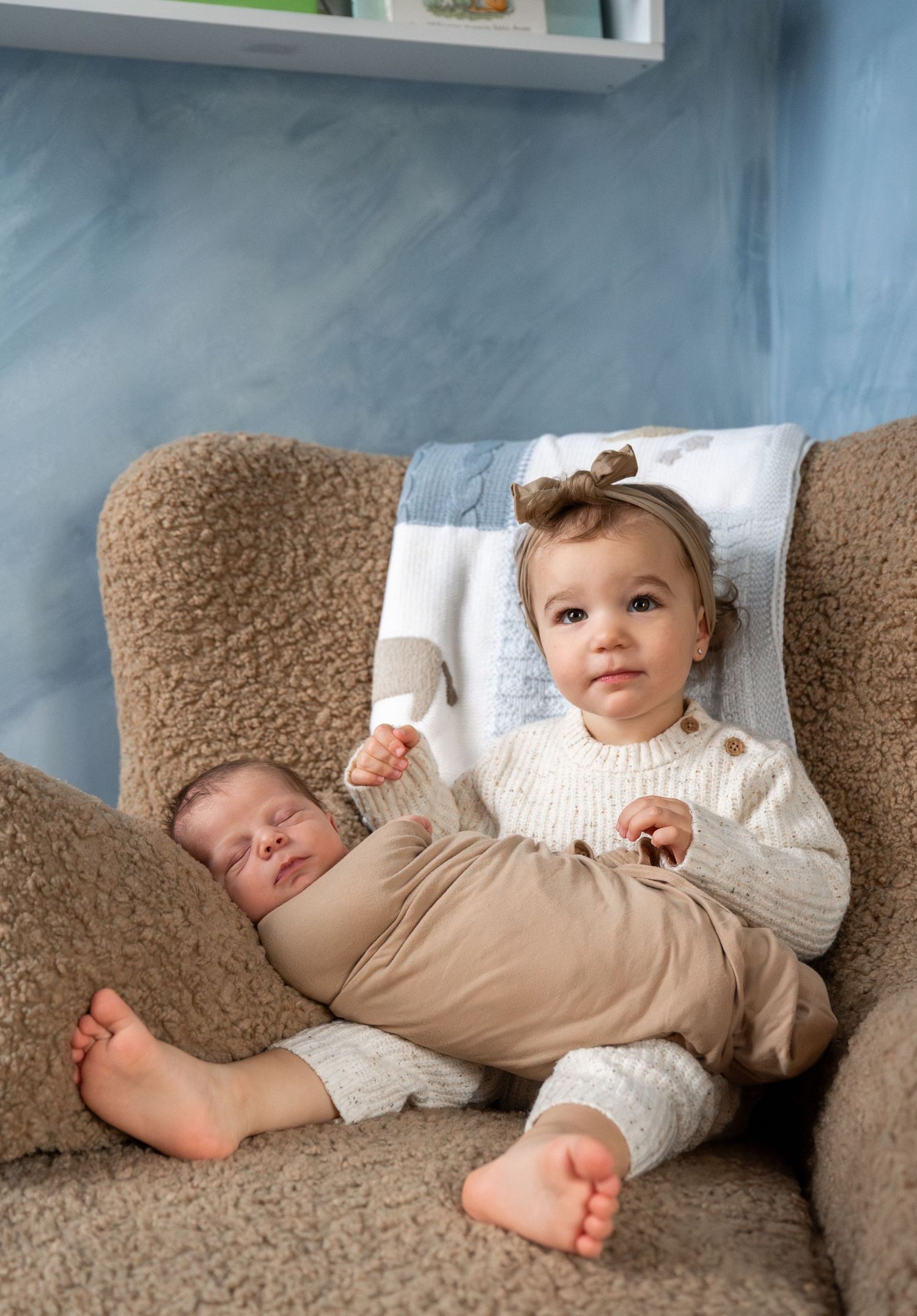 A series of photos showing a baby relaxing on a beige couch in casual attire.