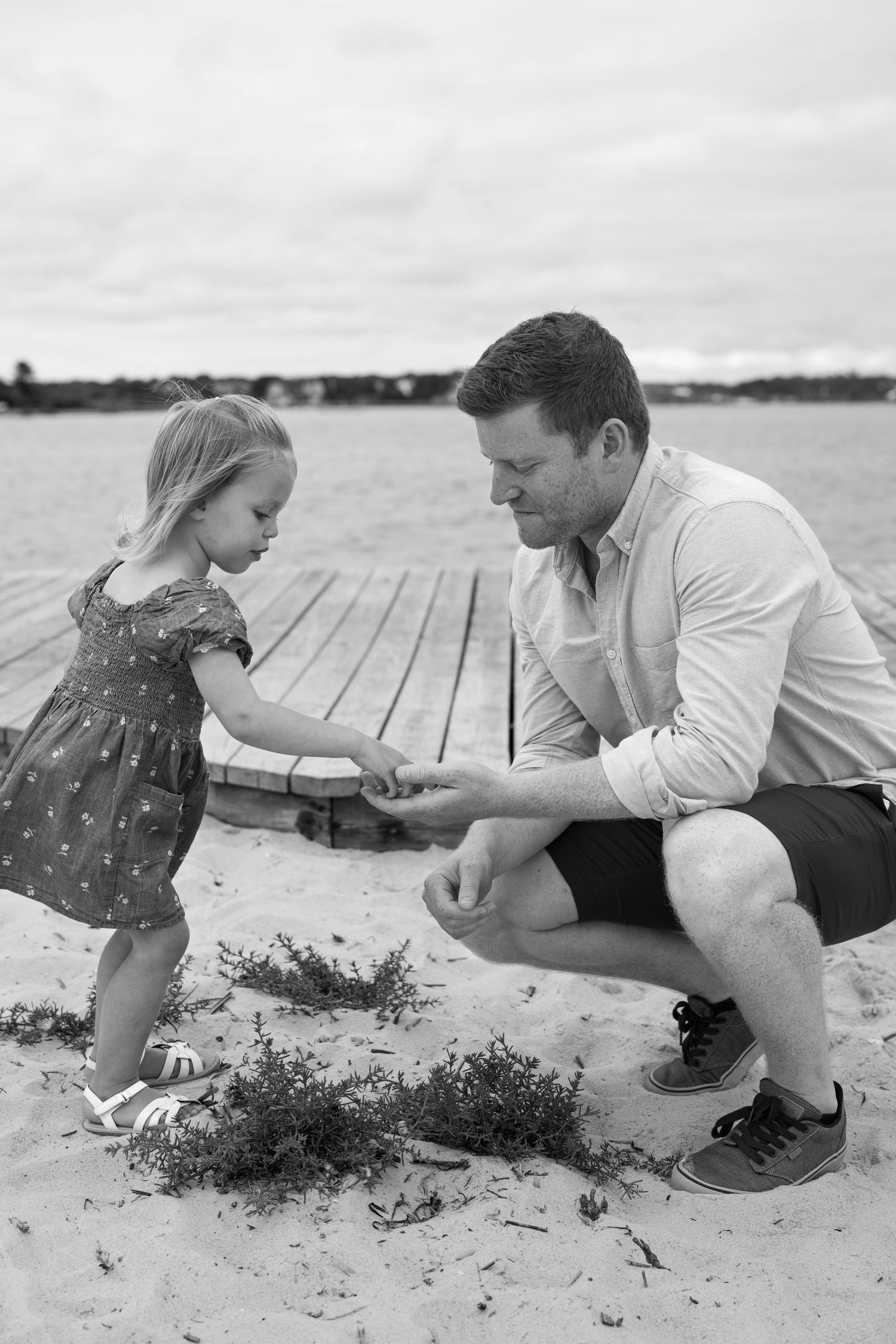 Black and white photos of beach exploration and discovery moments.