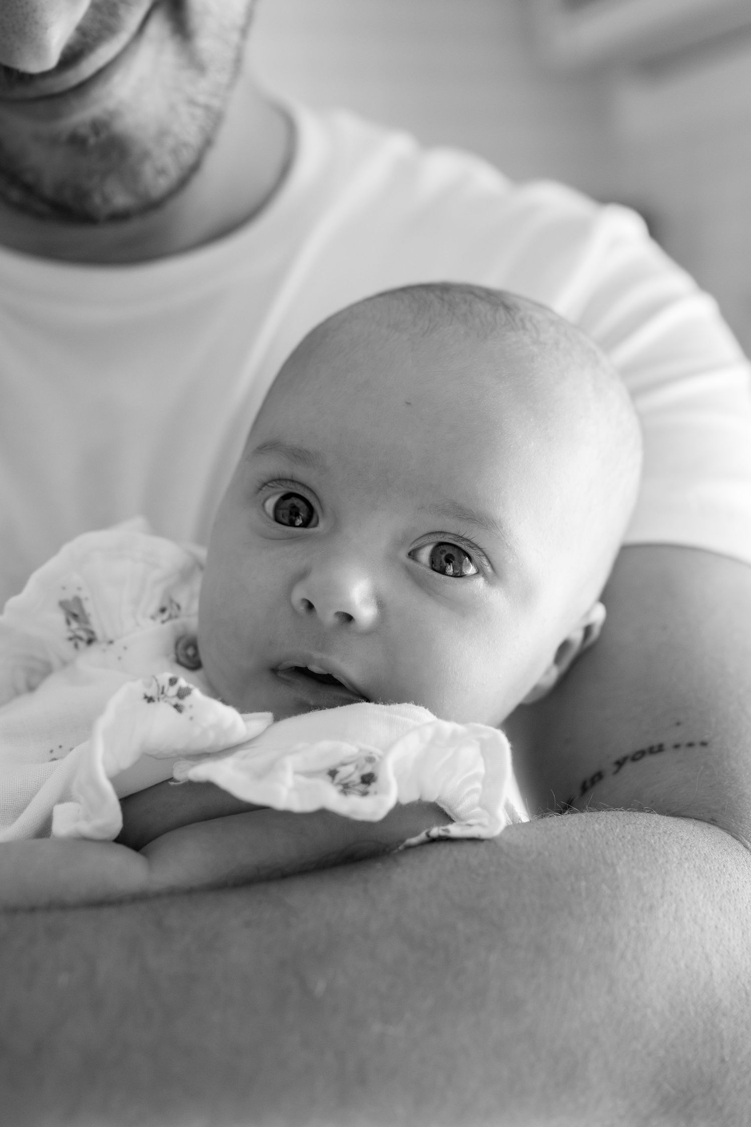 Intimate black and white portraits of sleeping infant resting peacefully.