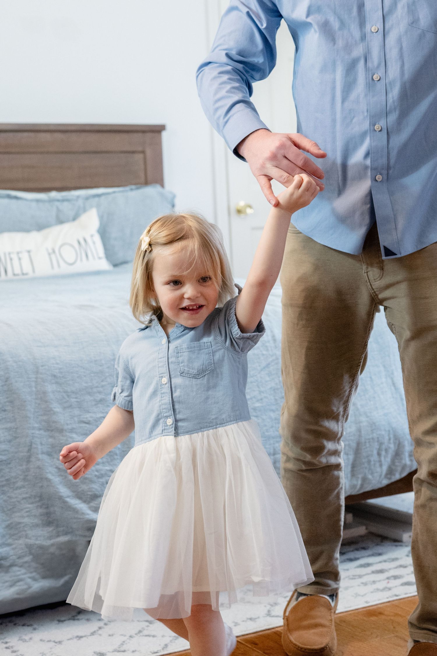 Sequence showing joyful moments with a small child in a tulle dress.