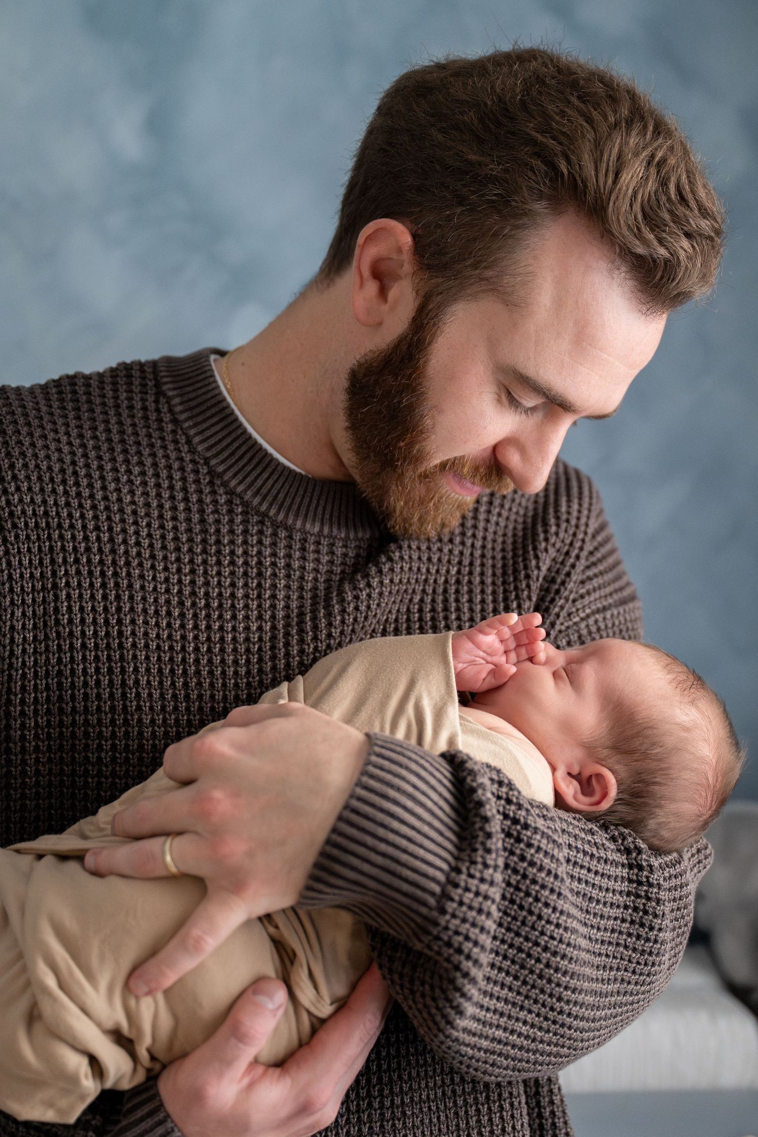 Sequential photos show affectionate interaction between a parent wearing a brown sweater and a small child.