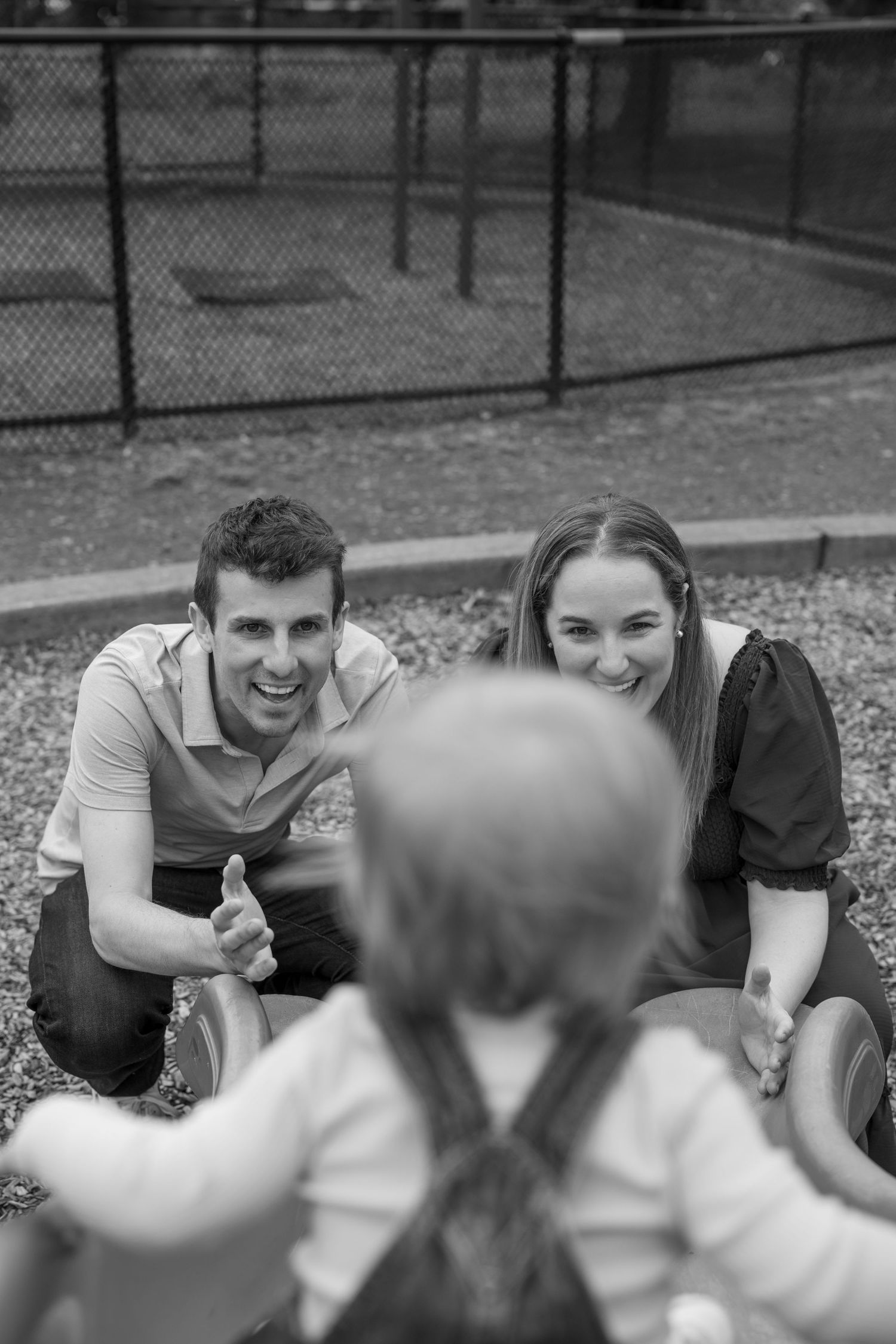 A series of candid black and white photos showing playful interaction and laughter.