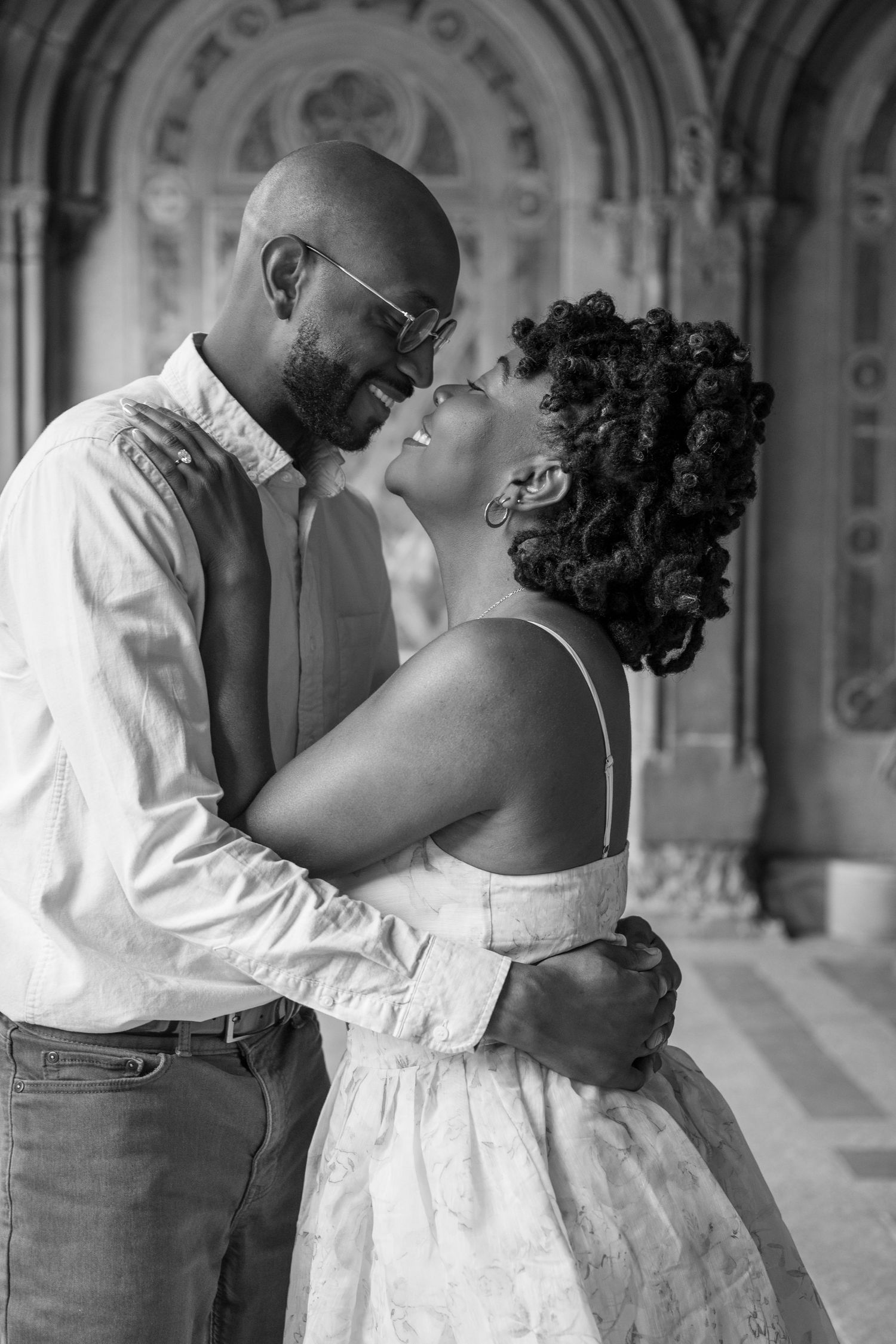 A romantic black and white photo series shows a couple sharing intimate kisses in formal wedding attire.