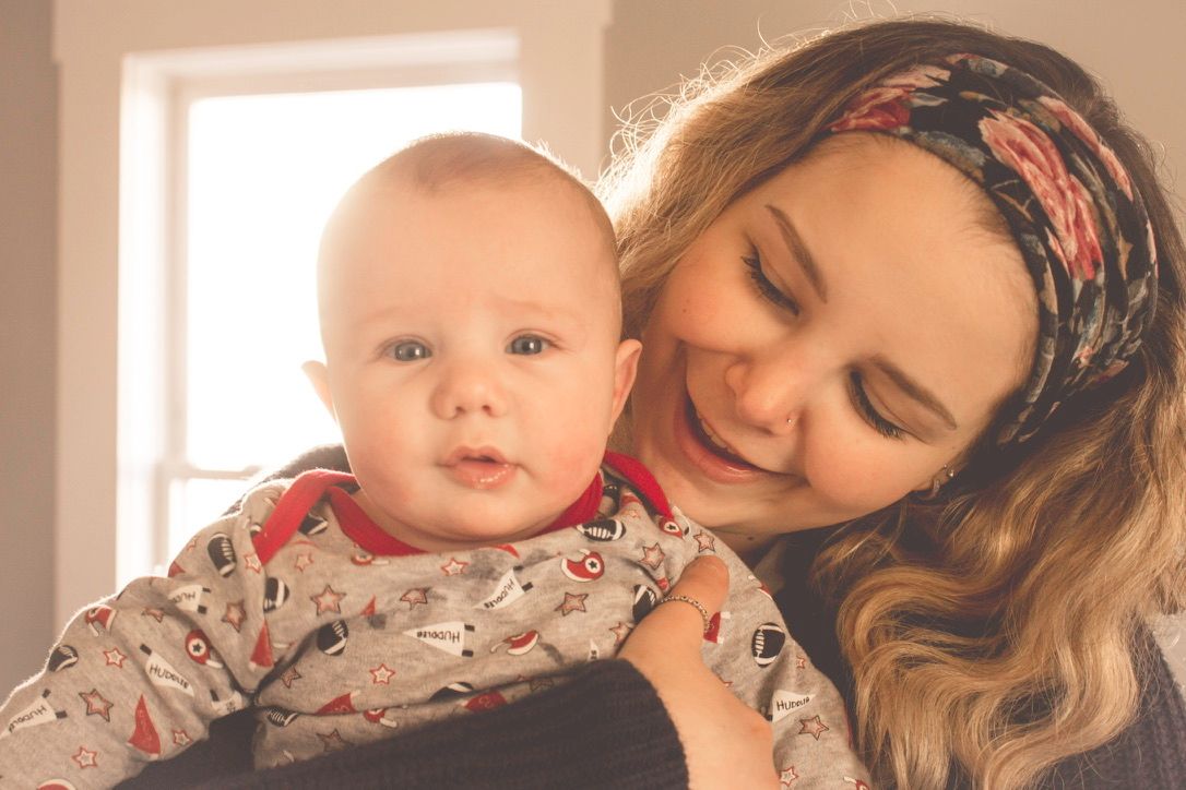 A series of tender indoor moments captured in warm lighting showing parent and child bonding.