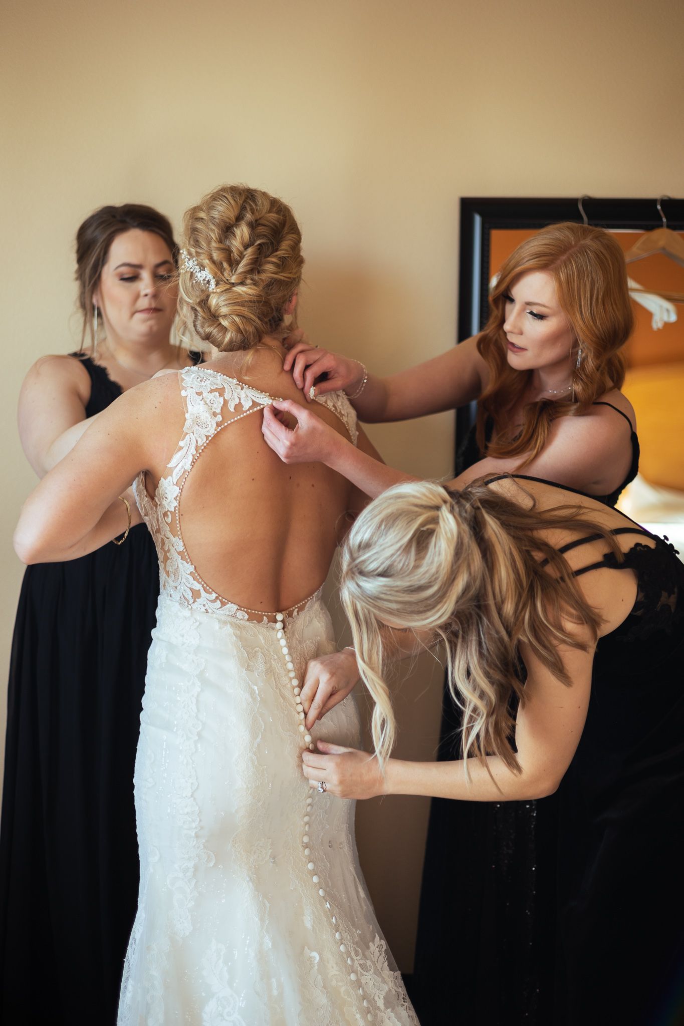 Wedding dress being buttoned up in a sequence of getting-ready photos.