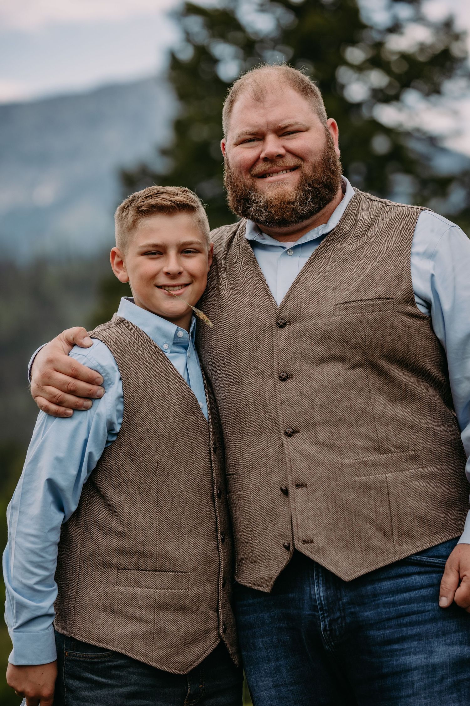 Close-up progression shots showing matching brown vests and blue shirts against mountain scenery.