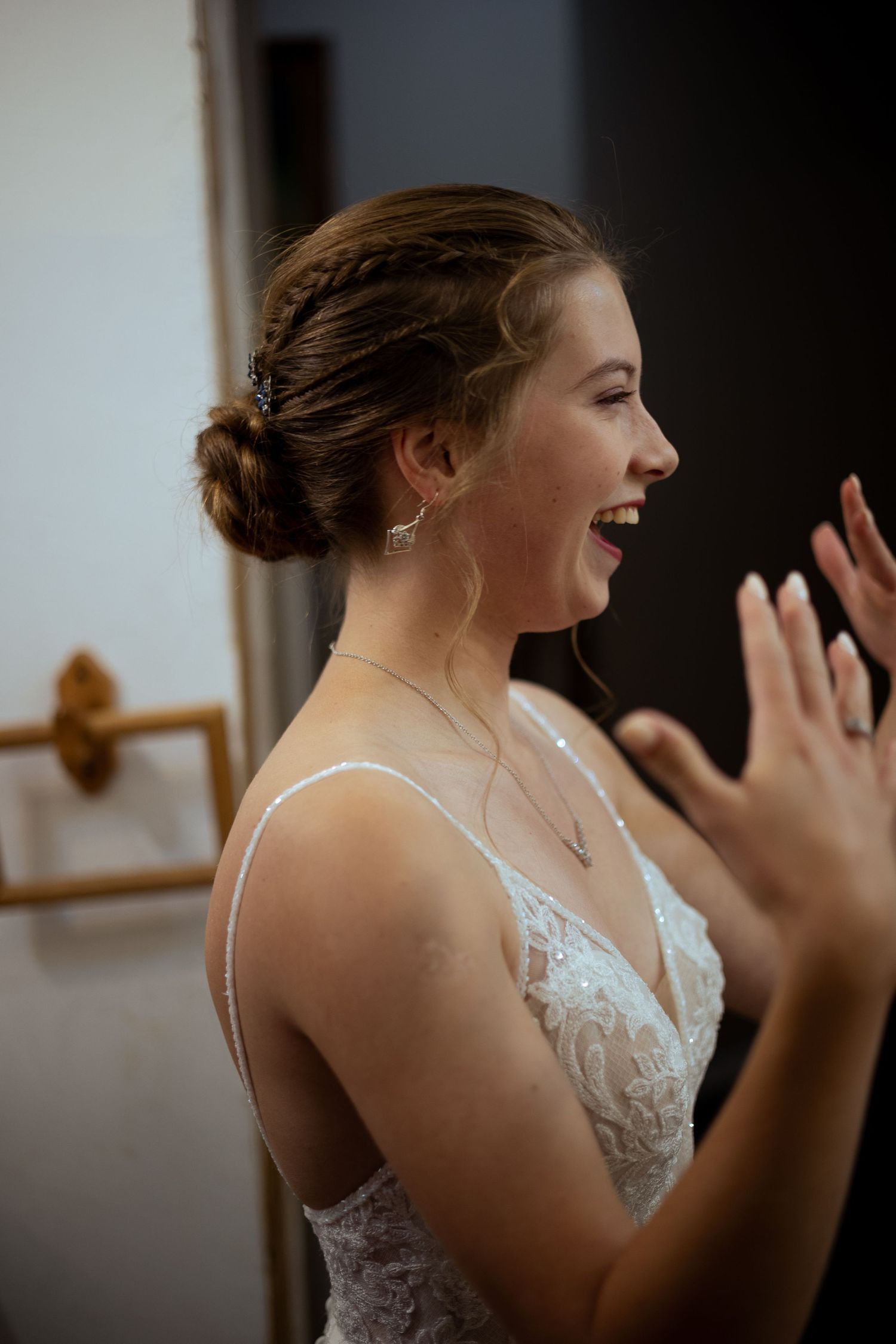 Close-up sequence shows joyful expressions and laughter in white lace dress.