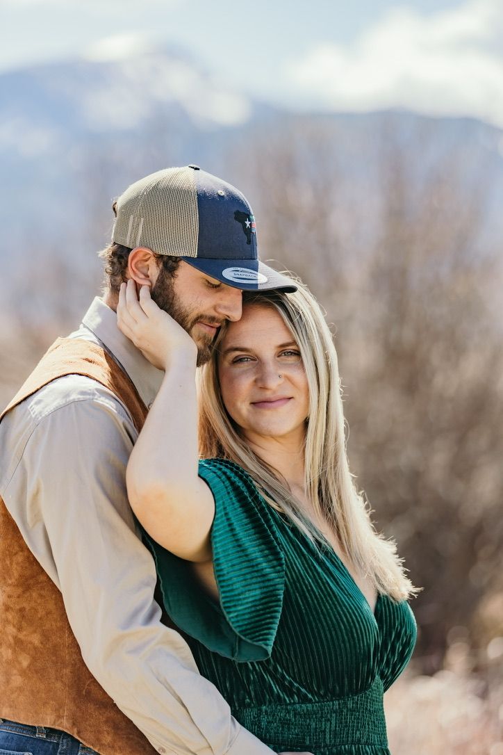 Couple in casual winter wear sharing intimate moment outdoors.