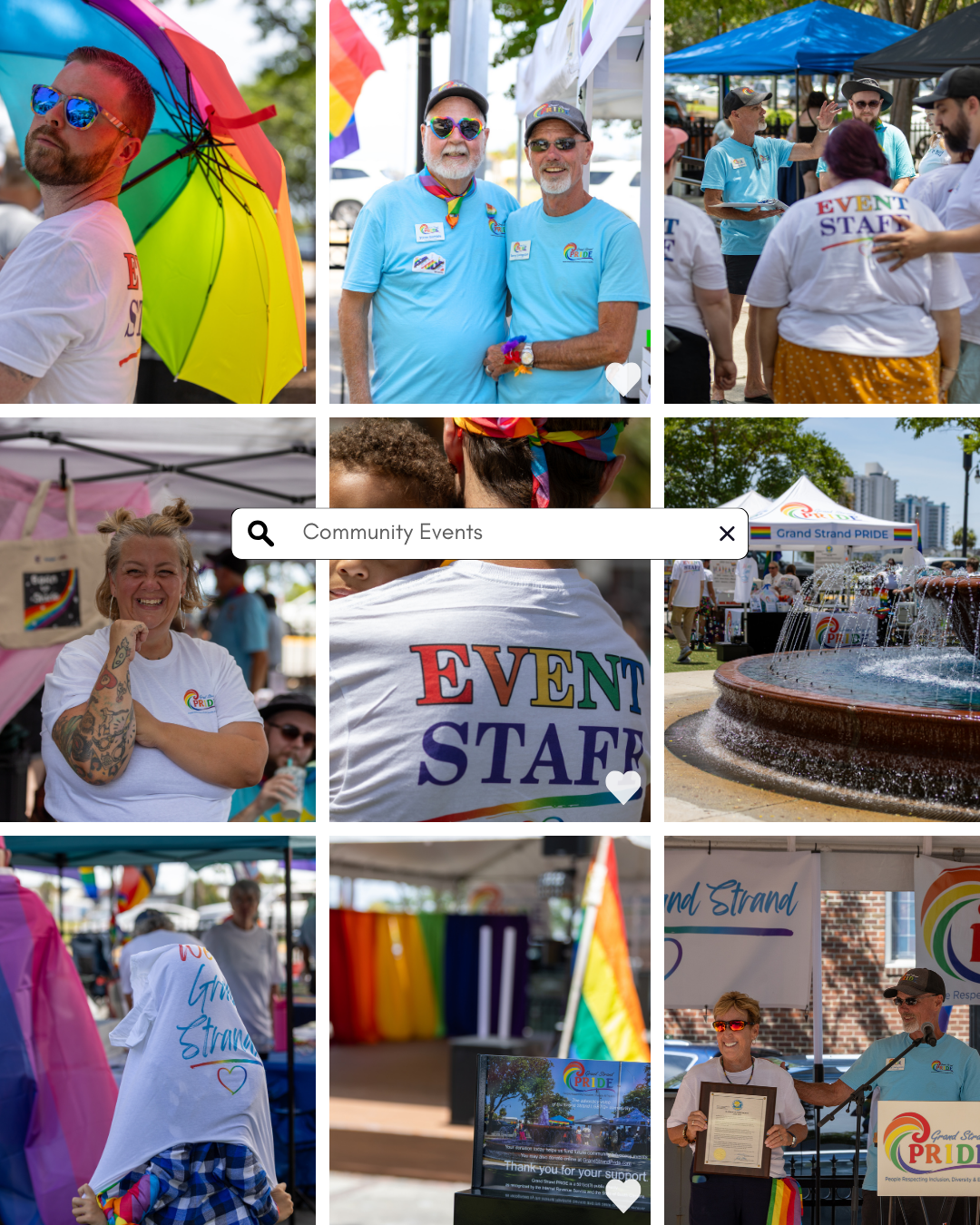 Colorful Pride community event with rainbow umbrellas, event staff shirts, fountain, and LGBTQ+ flags at an outdoor festival.