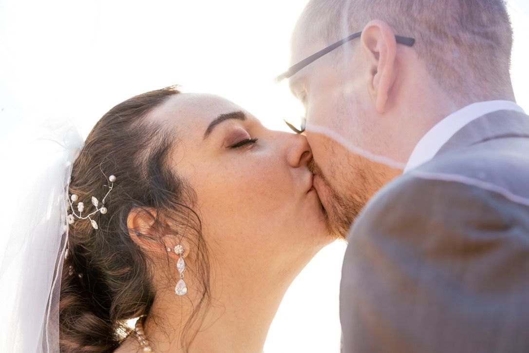 Intimate wedding moment captured during golden hour.