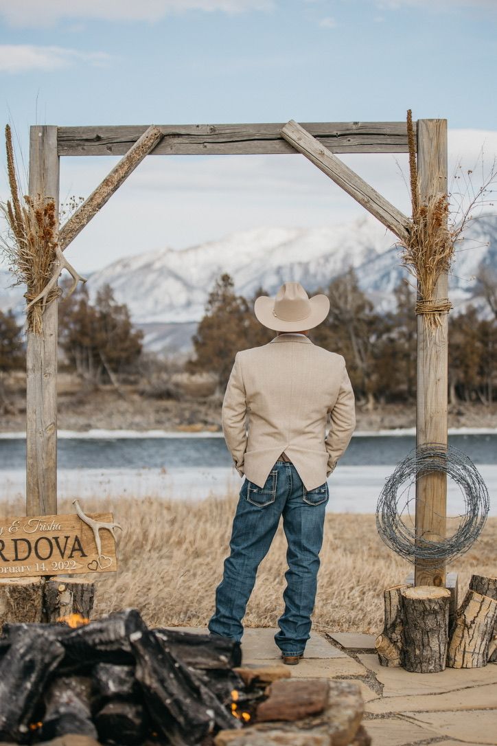 Western-themed wedding photos showing cowboy boots and rustic decor against a mountain backdrop.