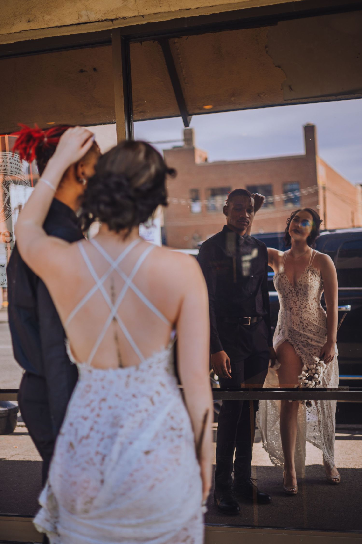 Wedding reception scene with guests mingling outdoors at dusk.