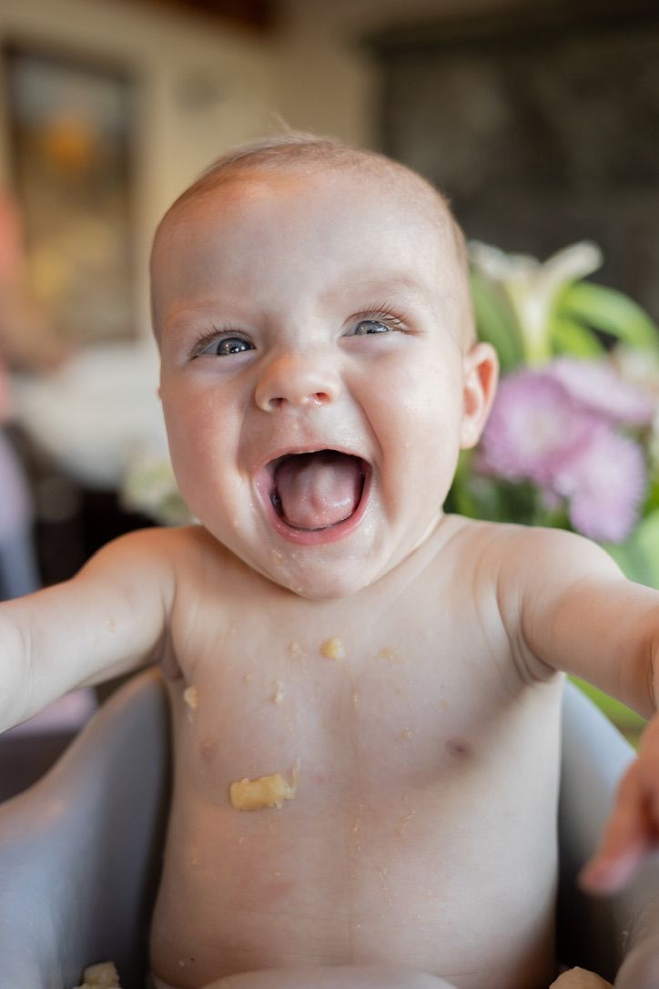 A joyful expression captured in a close-up indoor portrait.