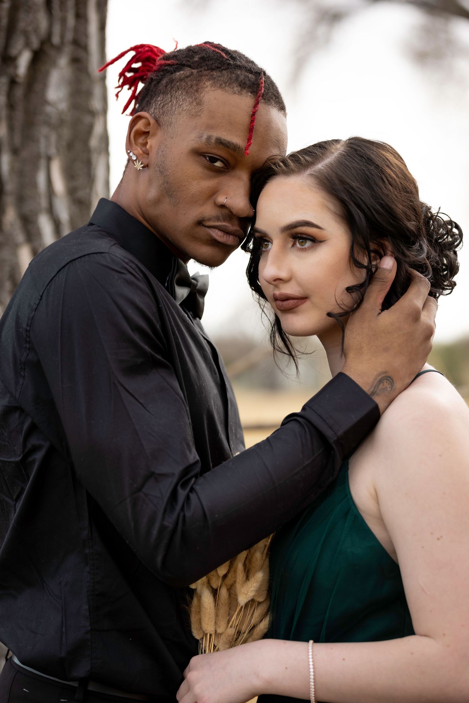 Intimate romantic portrait session in natural forest setting.