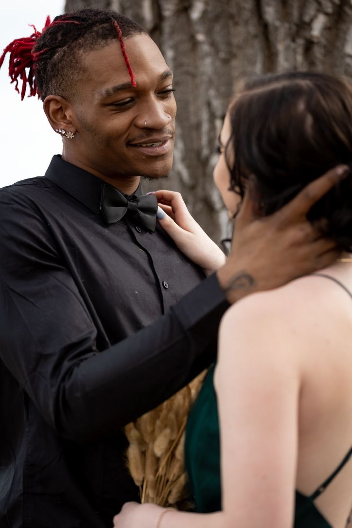 Intimate close-up of couple sharing tender moment during photoshoot.
