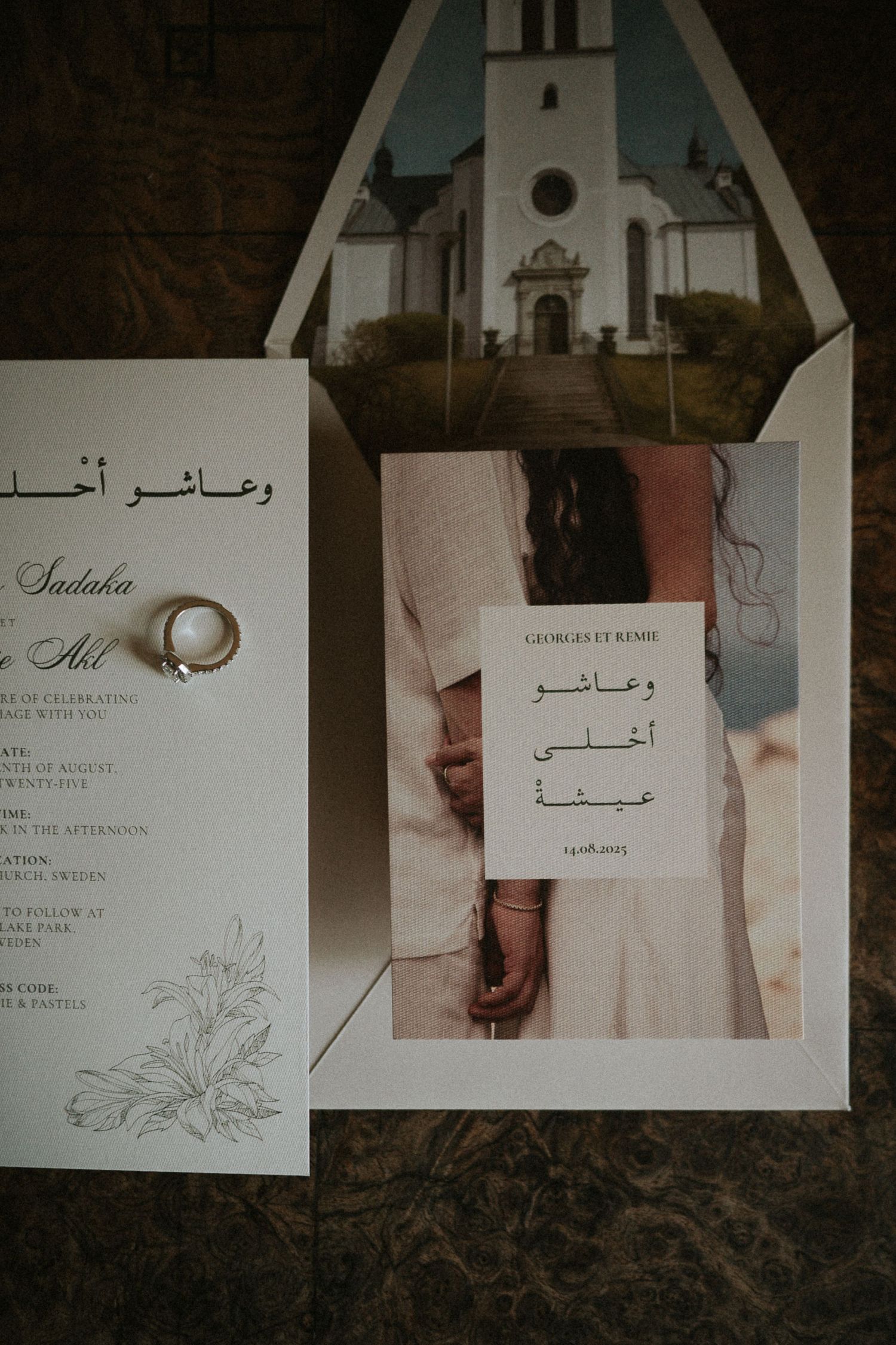 Bilingual Arabic English wedding invitation with church photo and gold ring on dark background.