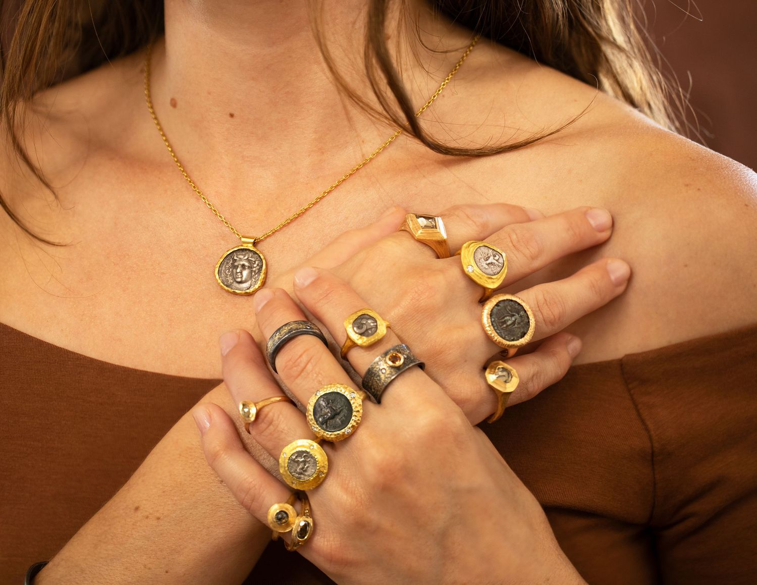 Model wearing ancient coin jewelry, close-up shot for an Oakland jewelry designer.