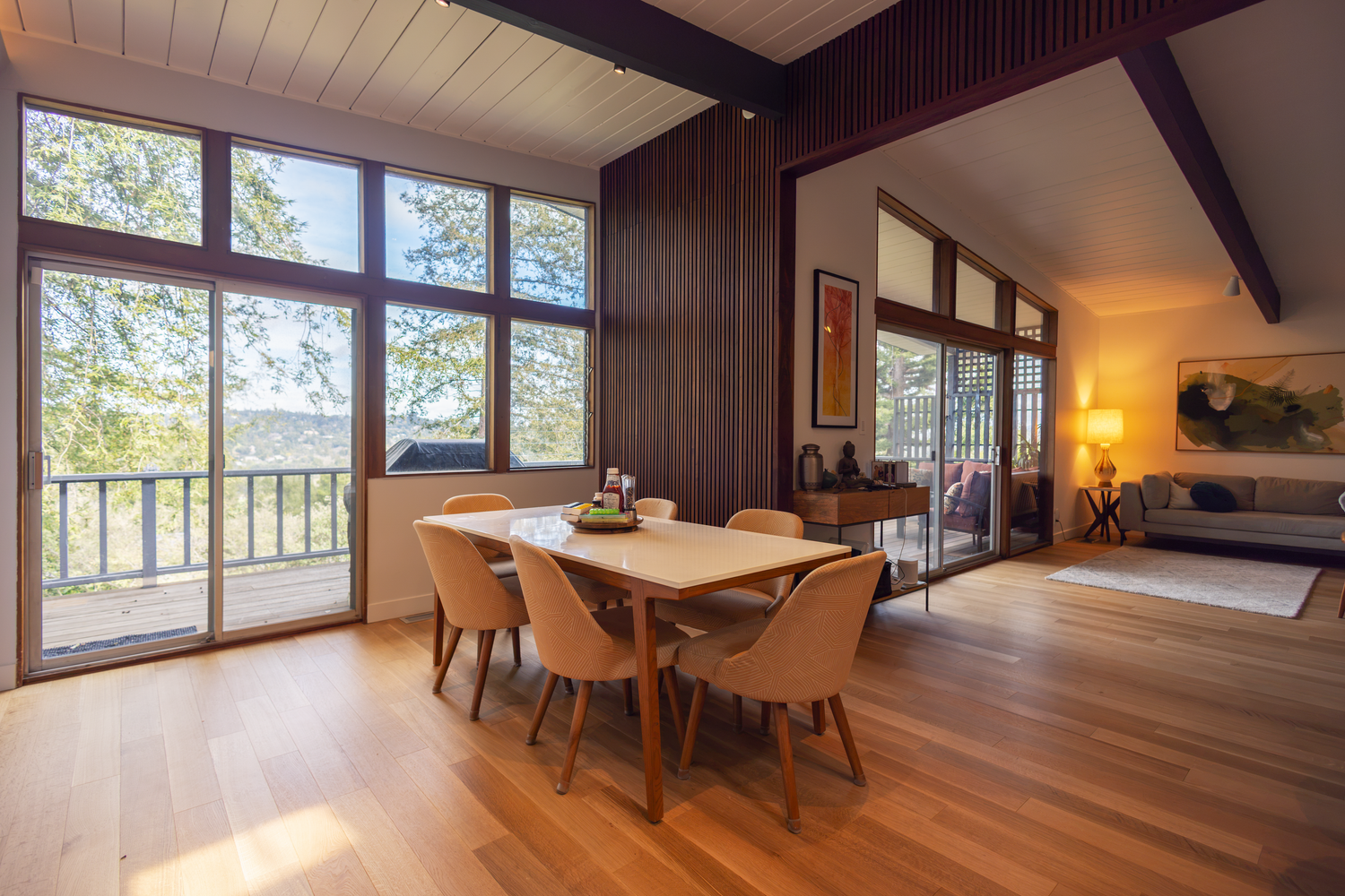 Open concept dining room and living room in high end home photographed for Berkeley-based architect.