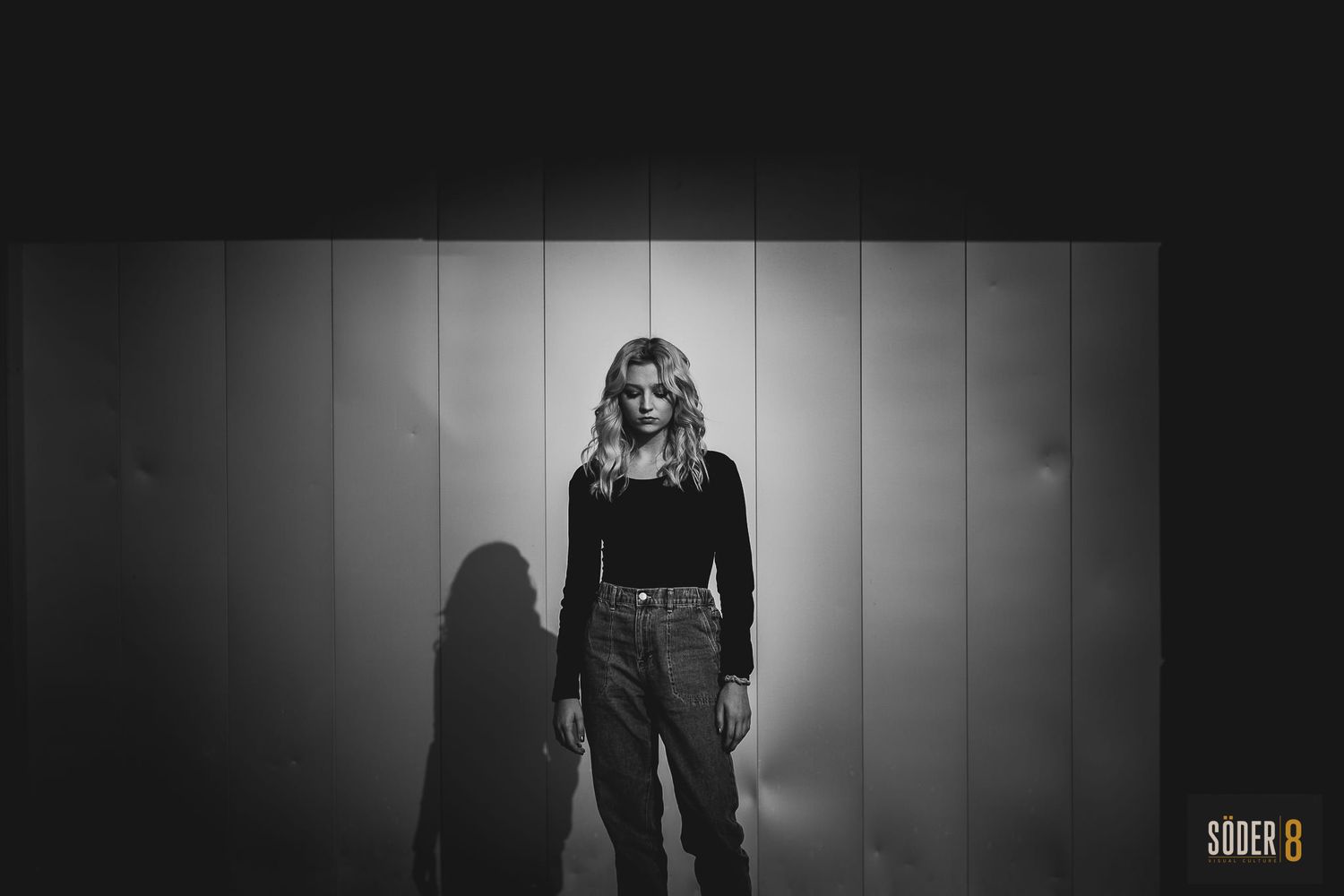 high school girl in mason city, iowa standing in light and shadows for black and white image - soder 8