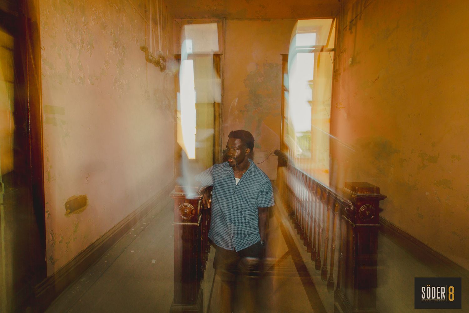 high school boy in old building in charles city, iowa with motion blur around him - soder 8