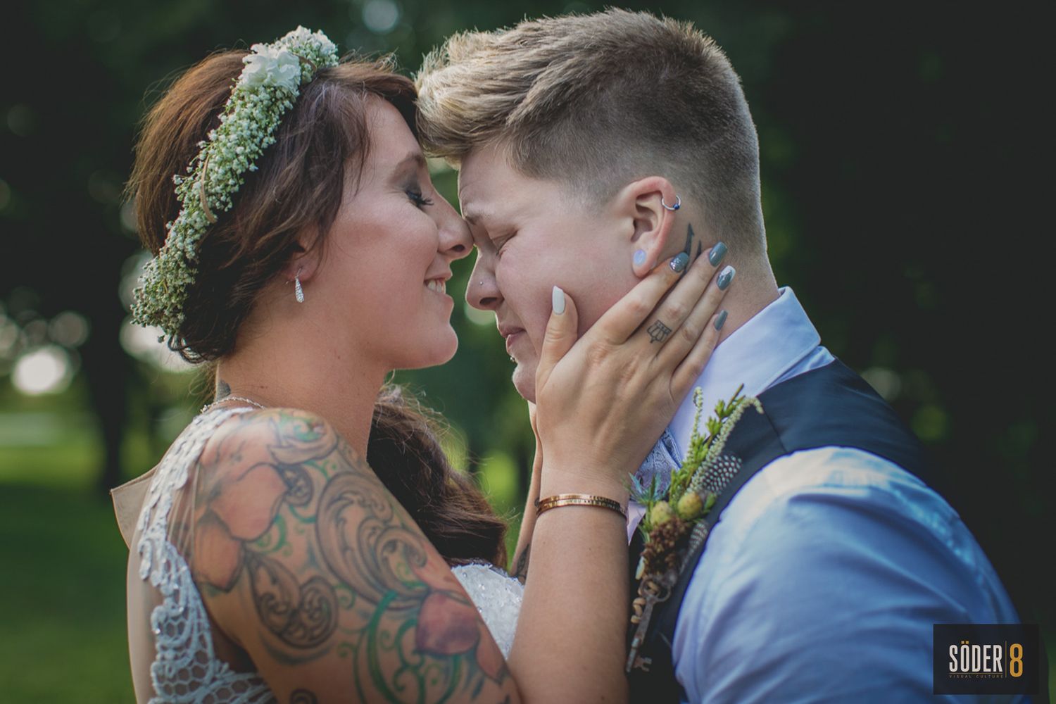 same sex couple in embrace at wedding
