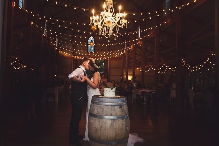 same sex bride and groom first dance at barn wedding in iowa