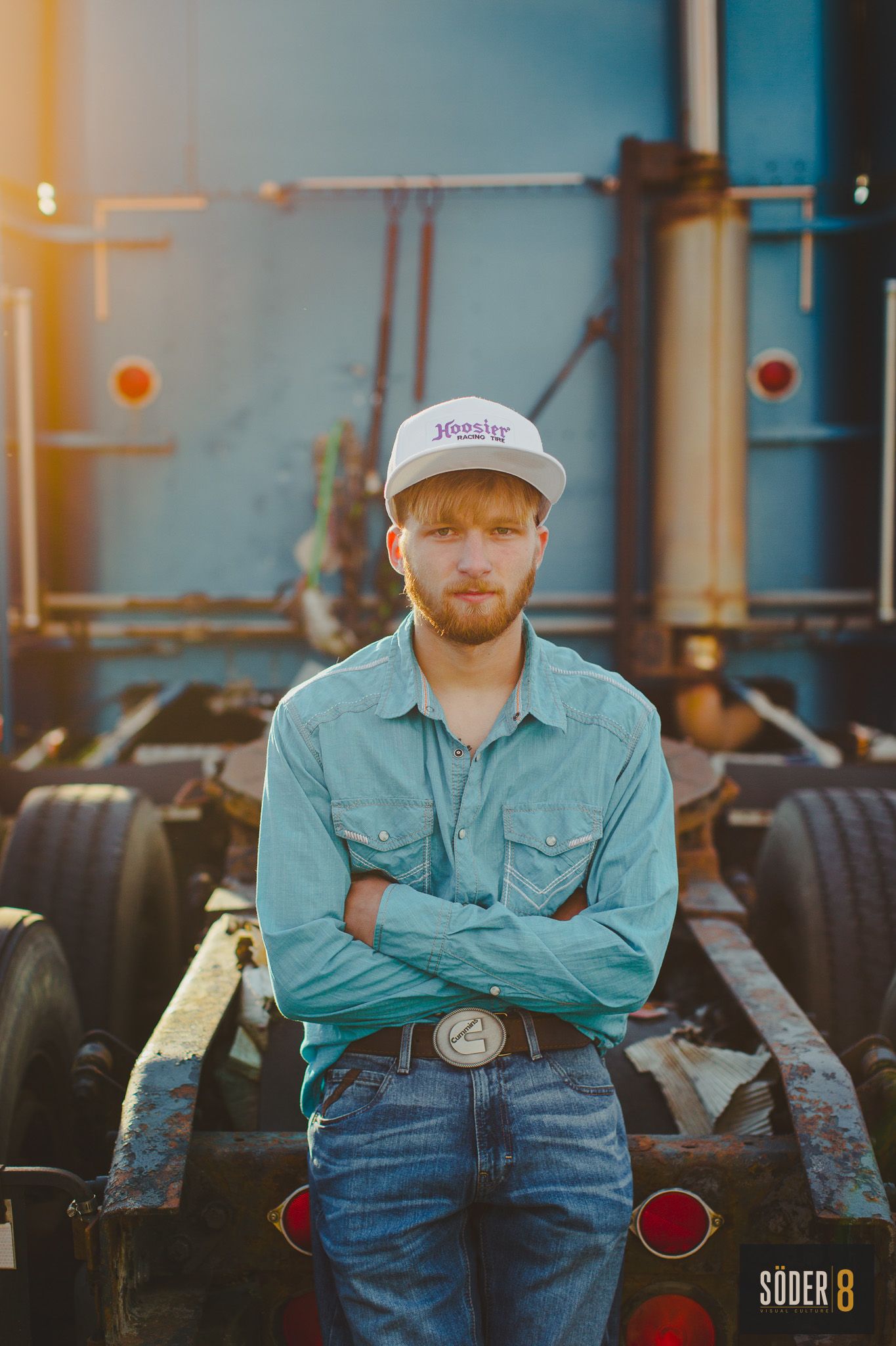high school senior boy standing in front of a semi truck in charles city, iowa - soder 8