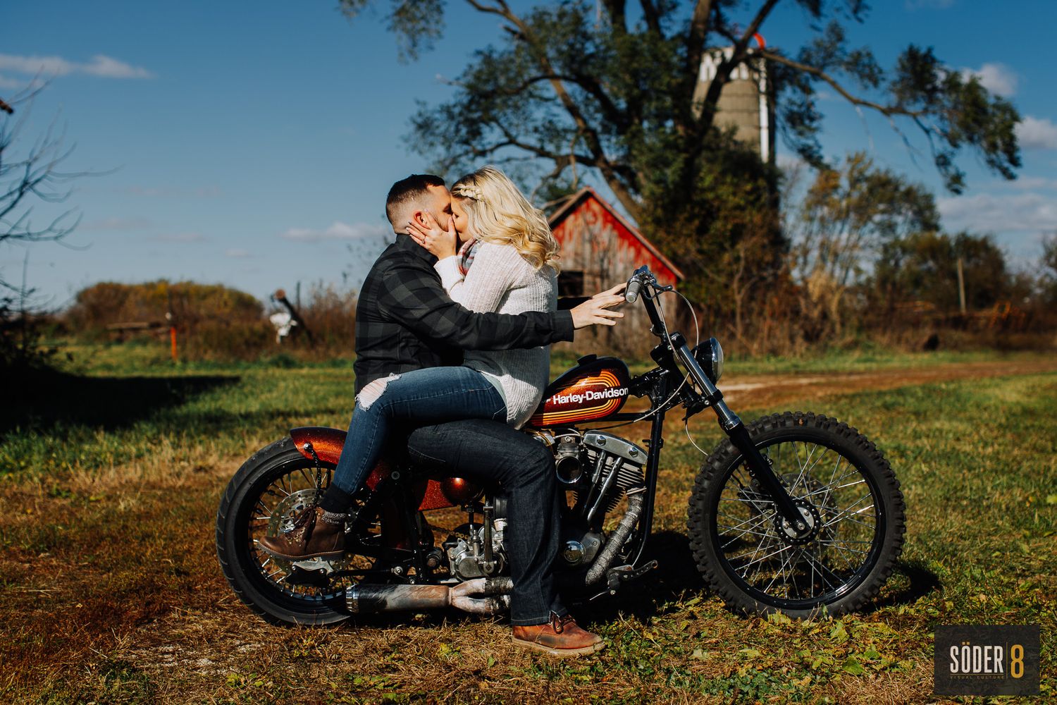couple on motorcycle kissing