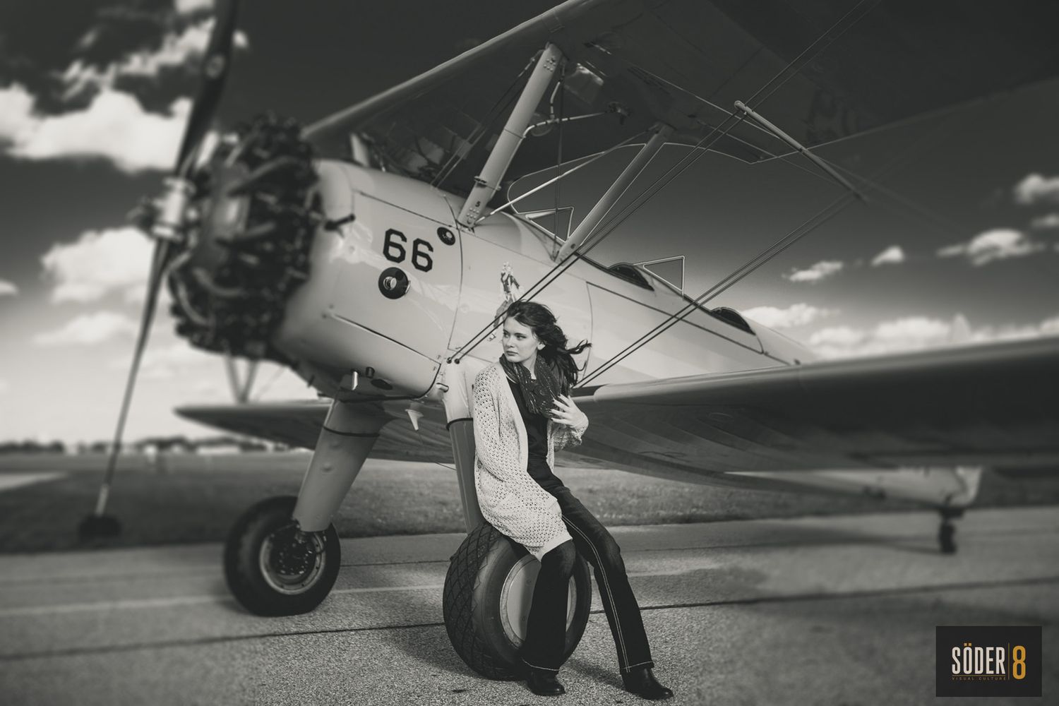 senior girl next to airplane in mason city