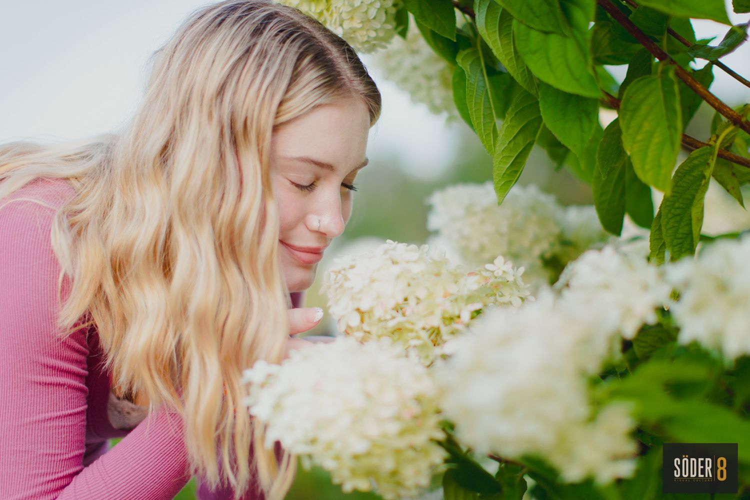 girl smelling flowers
