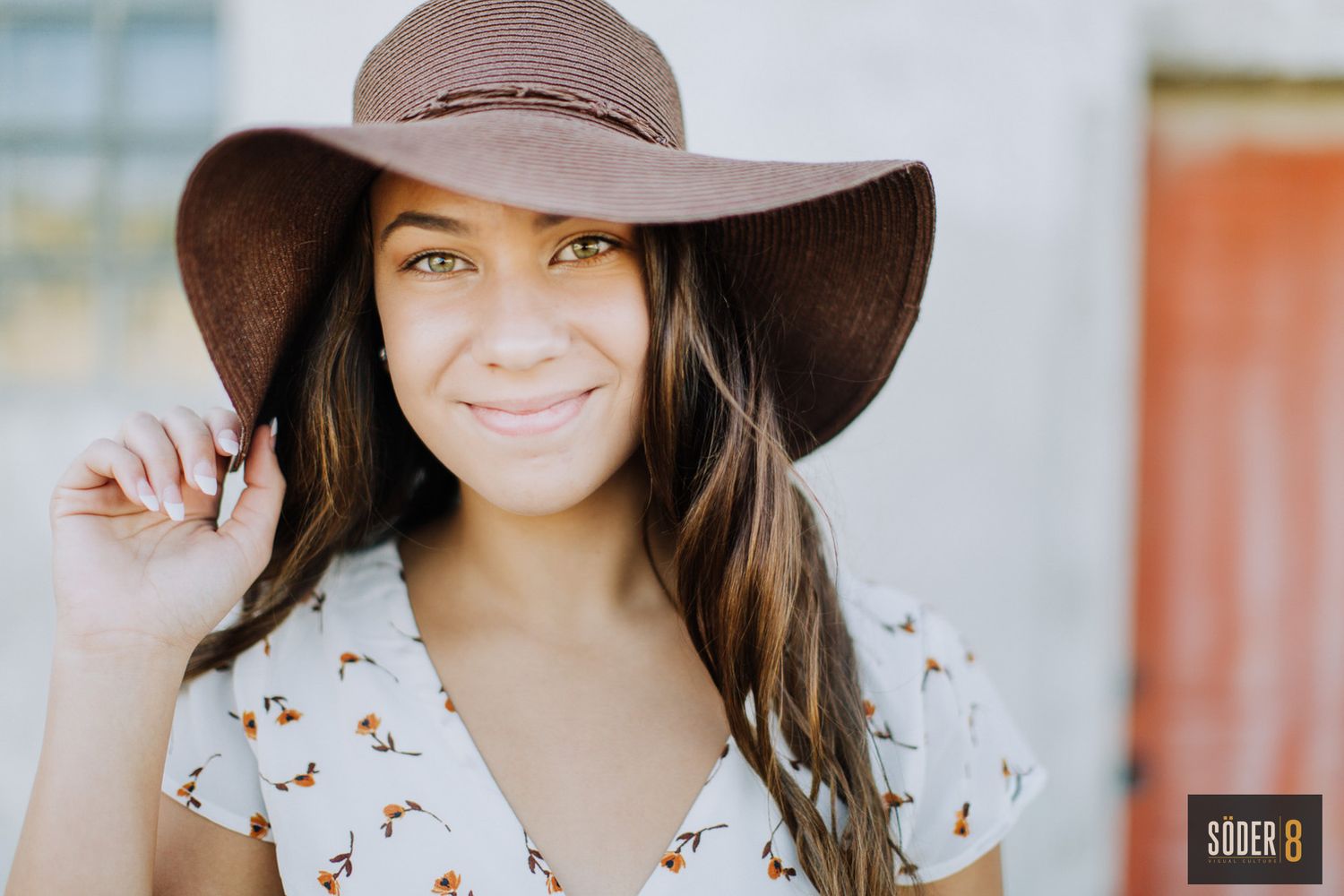 senior girl smiling and wearing a hat in Nora springs, Iowa - SODER 8
