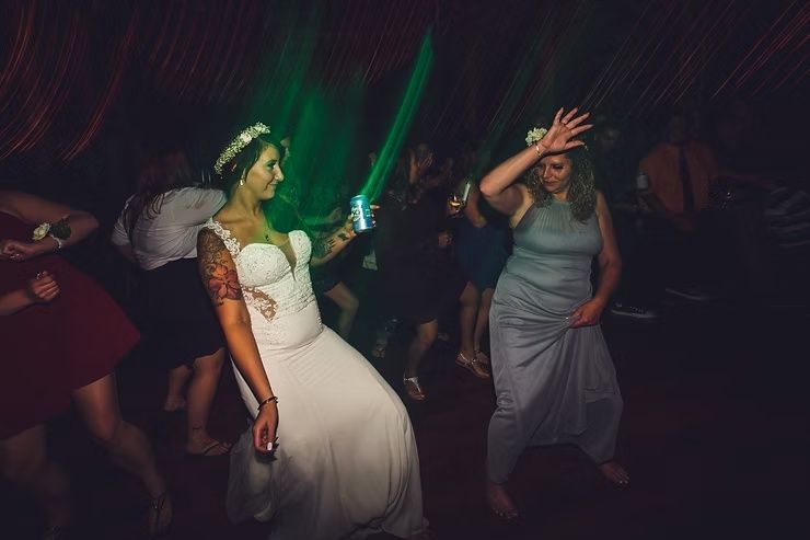 bride dancing on dance floor with bridesmaid at diamond oak events in clear lake, iowa
