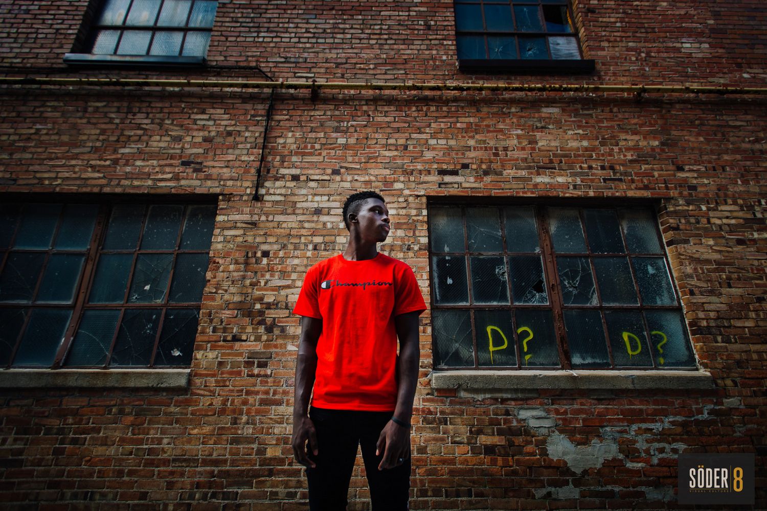 high school athlete standing in an alley in mason city, iowa - soder 8