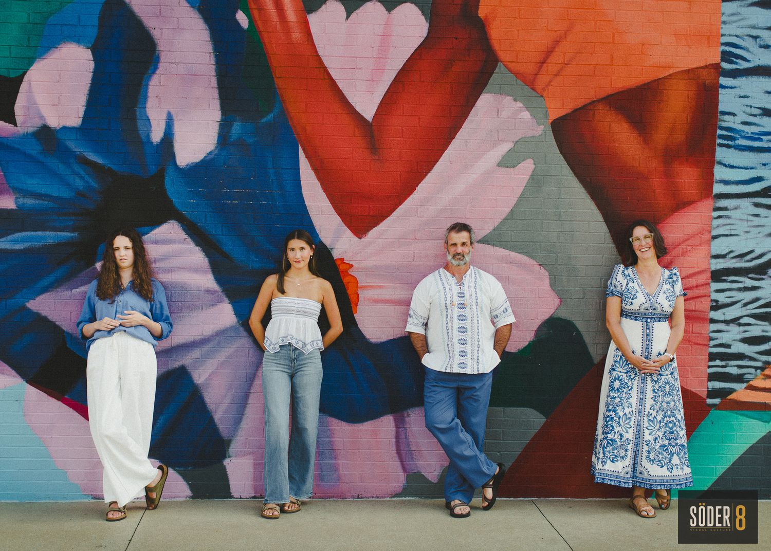 family photo against mural in charles city, iowa