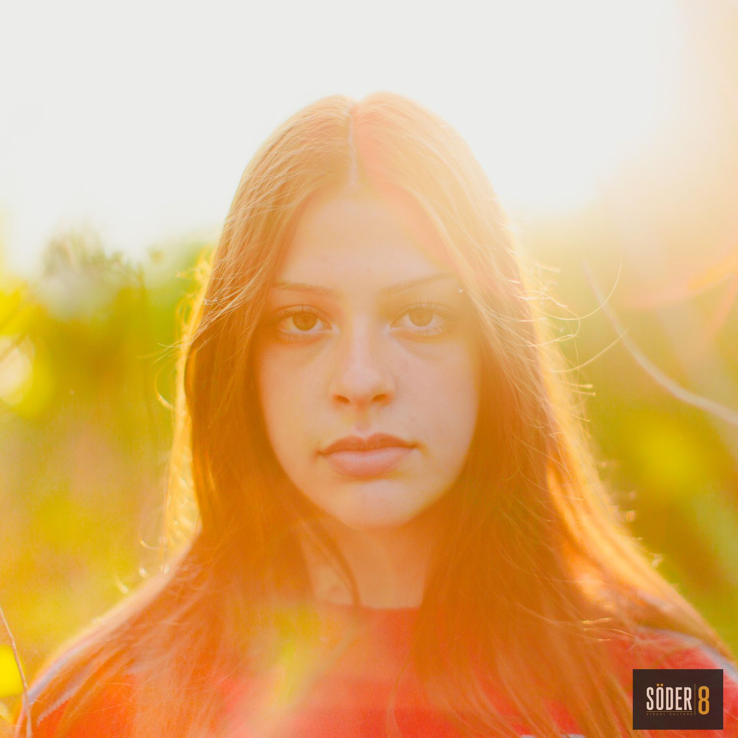 hs senior girl from cedar rapids, iowa at sunset in charles city, iowa with sun glowing around her - soder 8