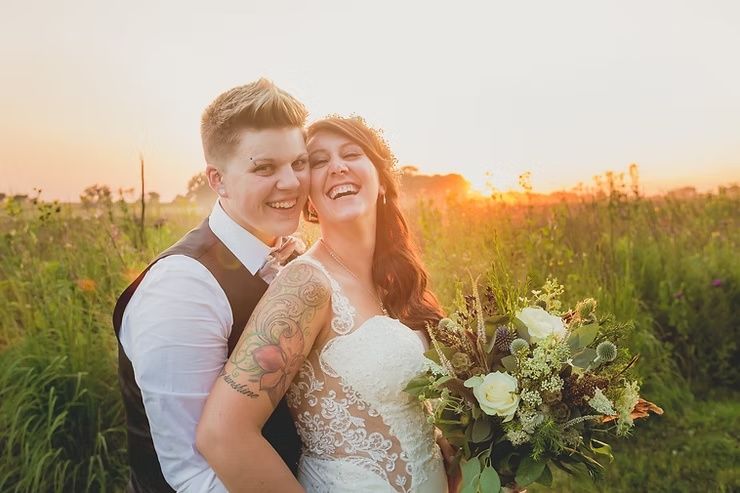 lgbtq bride and groom portrait at sunset