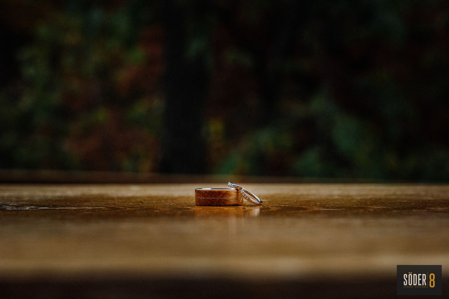 wedding rings on wooden table